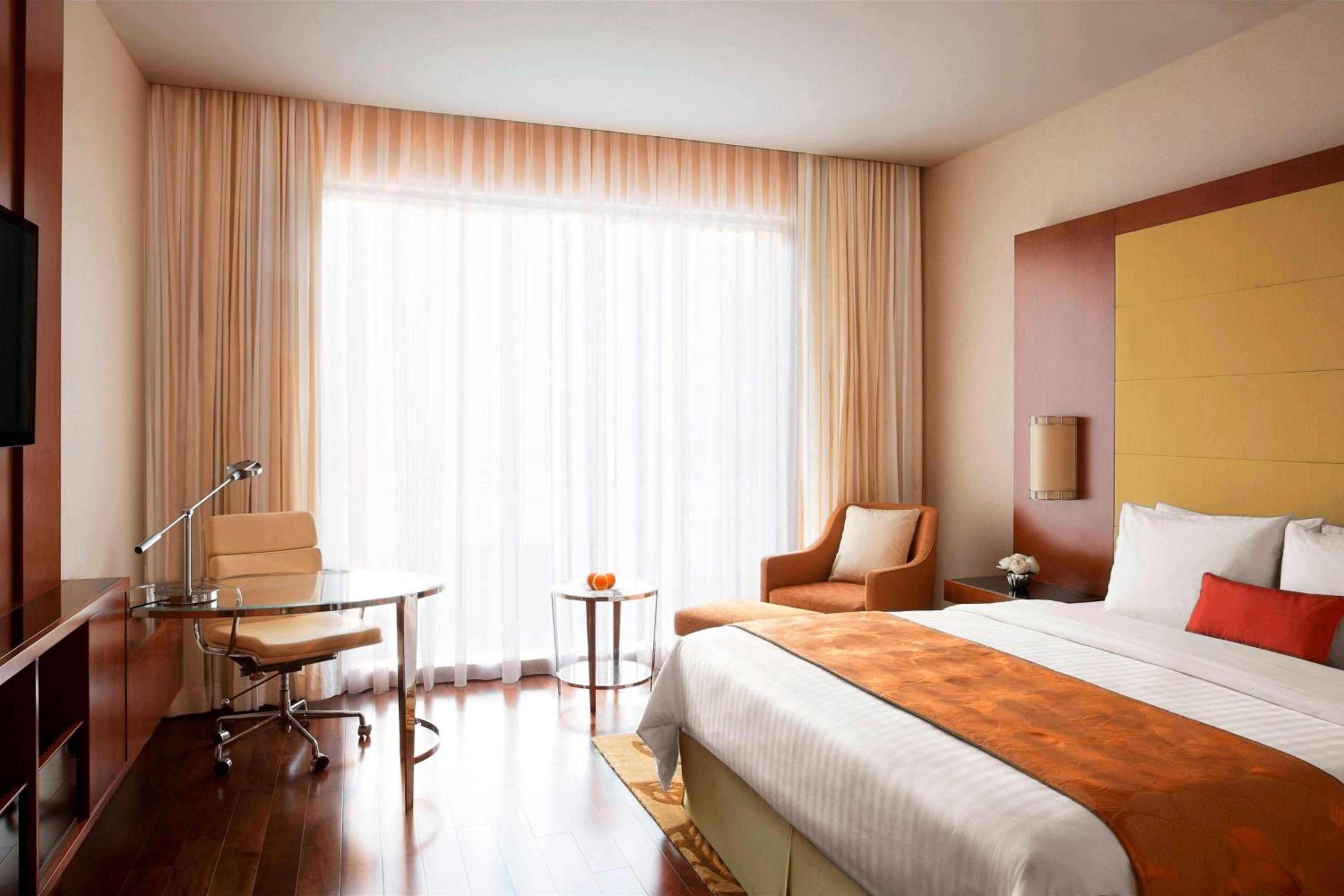 Executive King Room with complimentary Two-way airport transfers, Executive Lounge Access. INR 500 hotel credit inclusive of IRD (In-Room-Dining) per room per night, Access to Taberna Bar with unlimited beverages for two hours