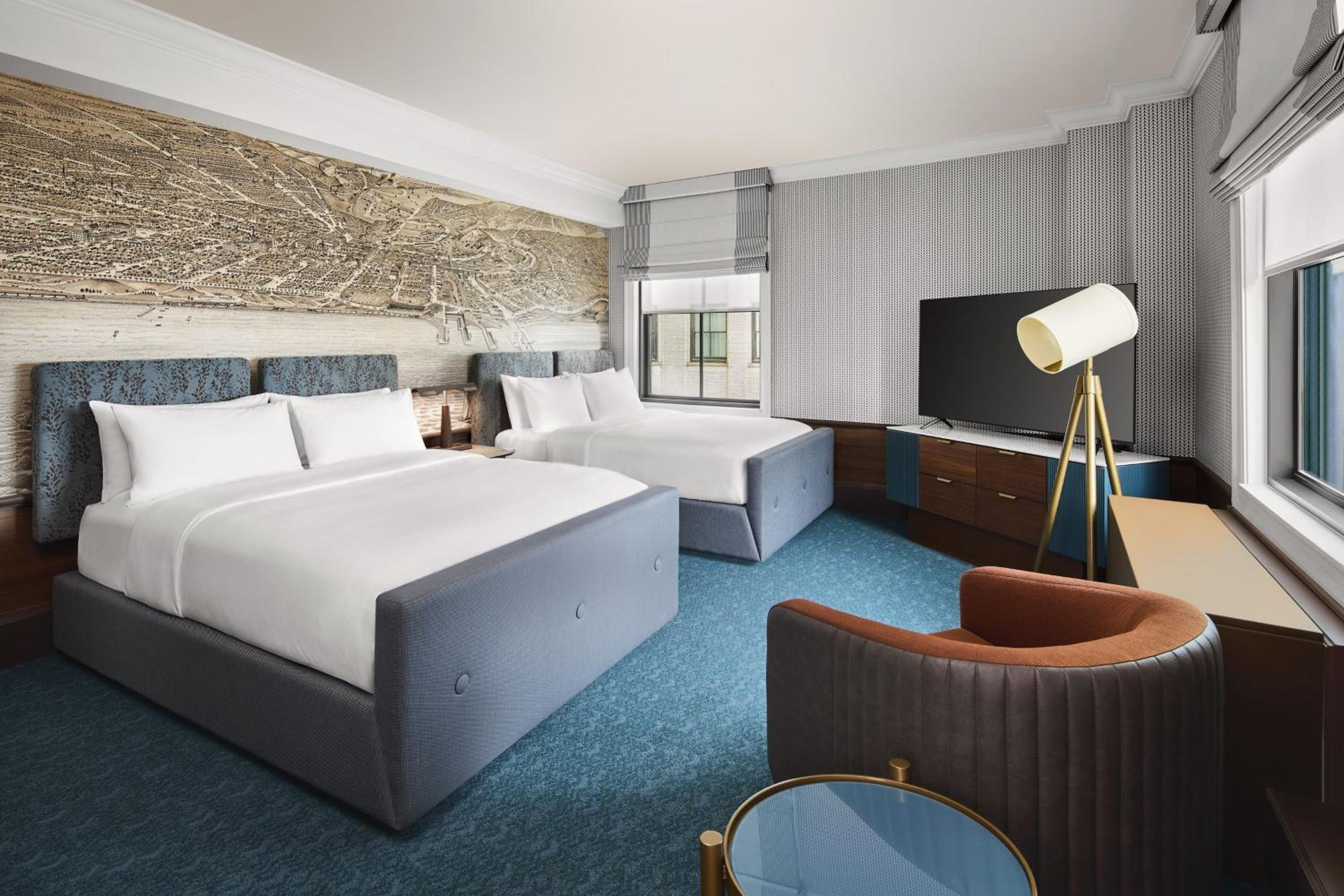 Queen Room with Two Queen Beds and Public Square View - Photo 7