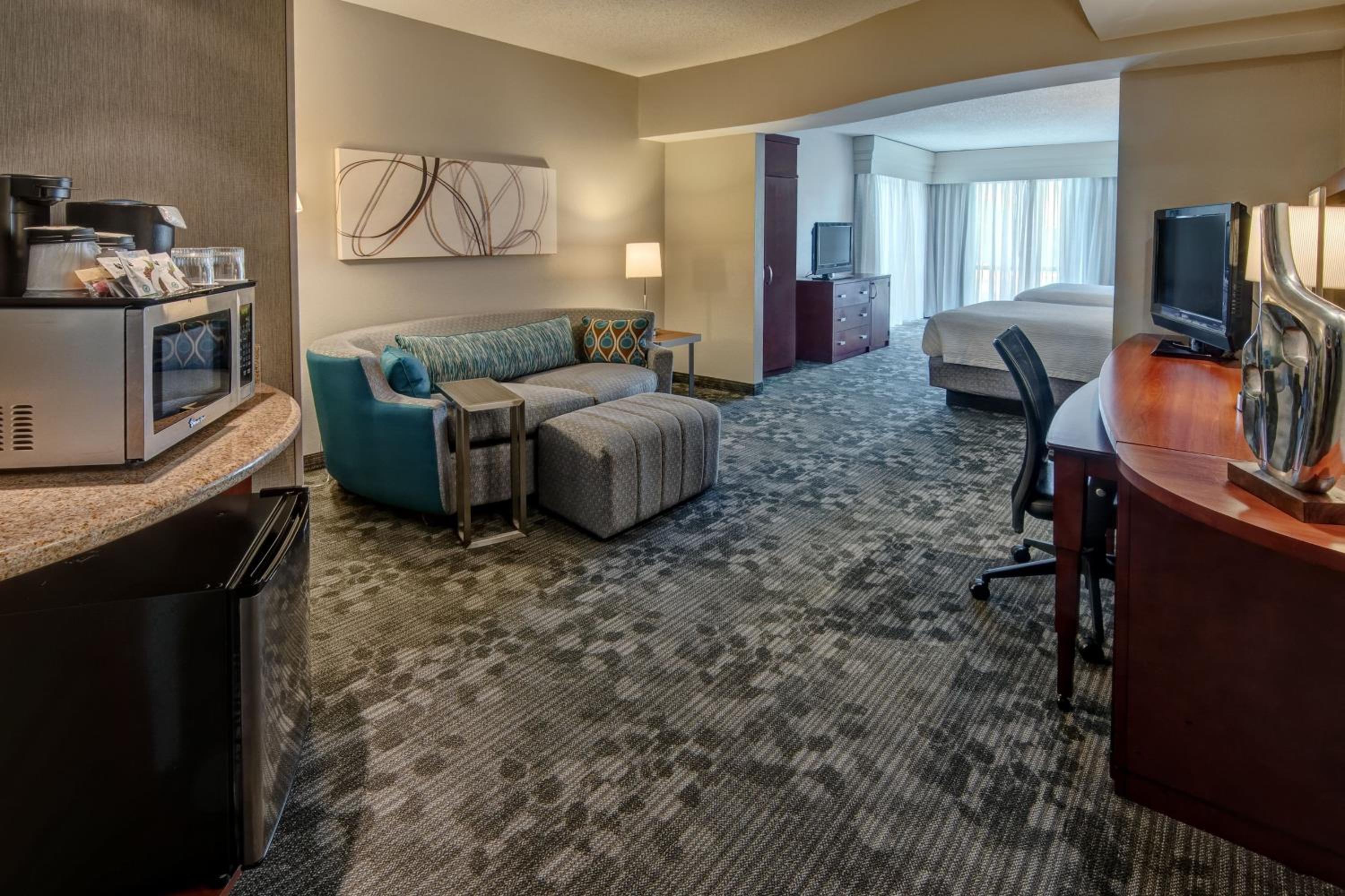 Queen Suite with Two Queen Beds and Sofa Bed - Photo 1