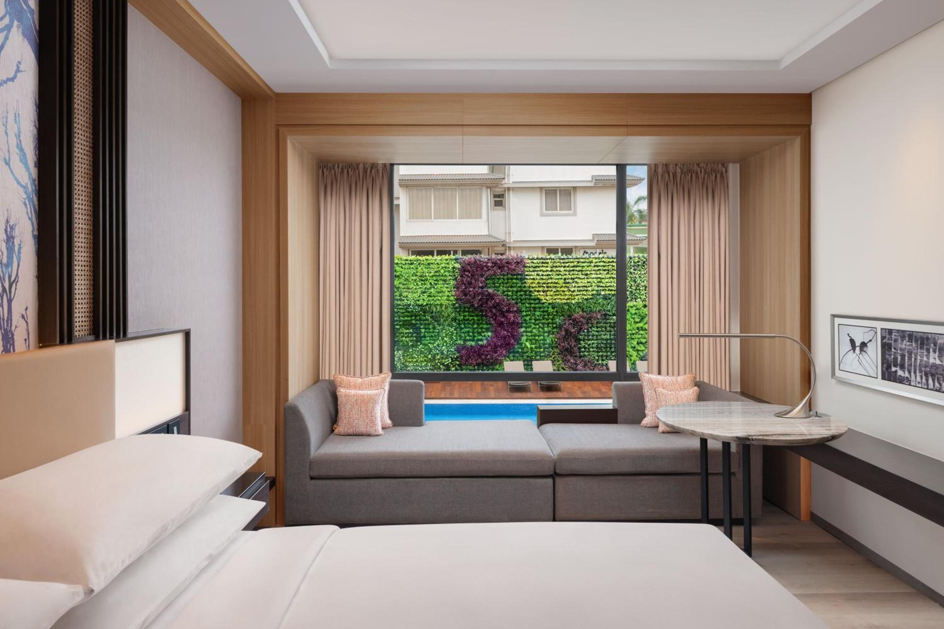 Deluxe Guest room, 1 King, Partial pool view with INR 500 Spa credit on min therapy of 60 mins per stay - Photo 2
