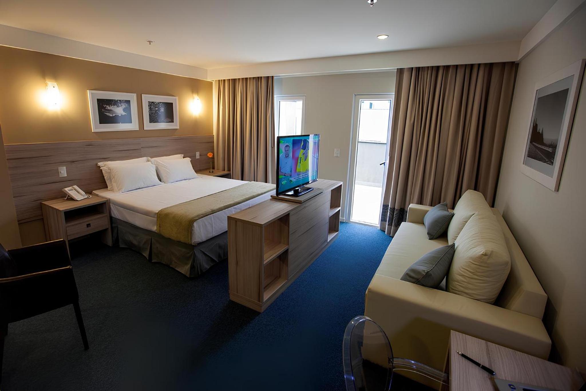 Premium Double - 1 King Bed and 1 Sofa bed photo 1