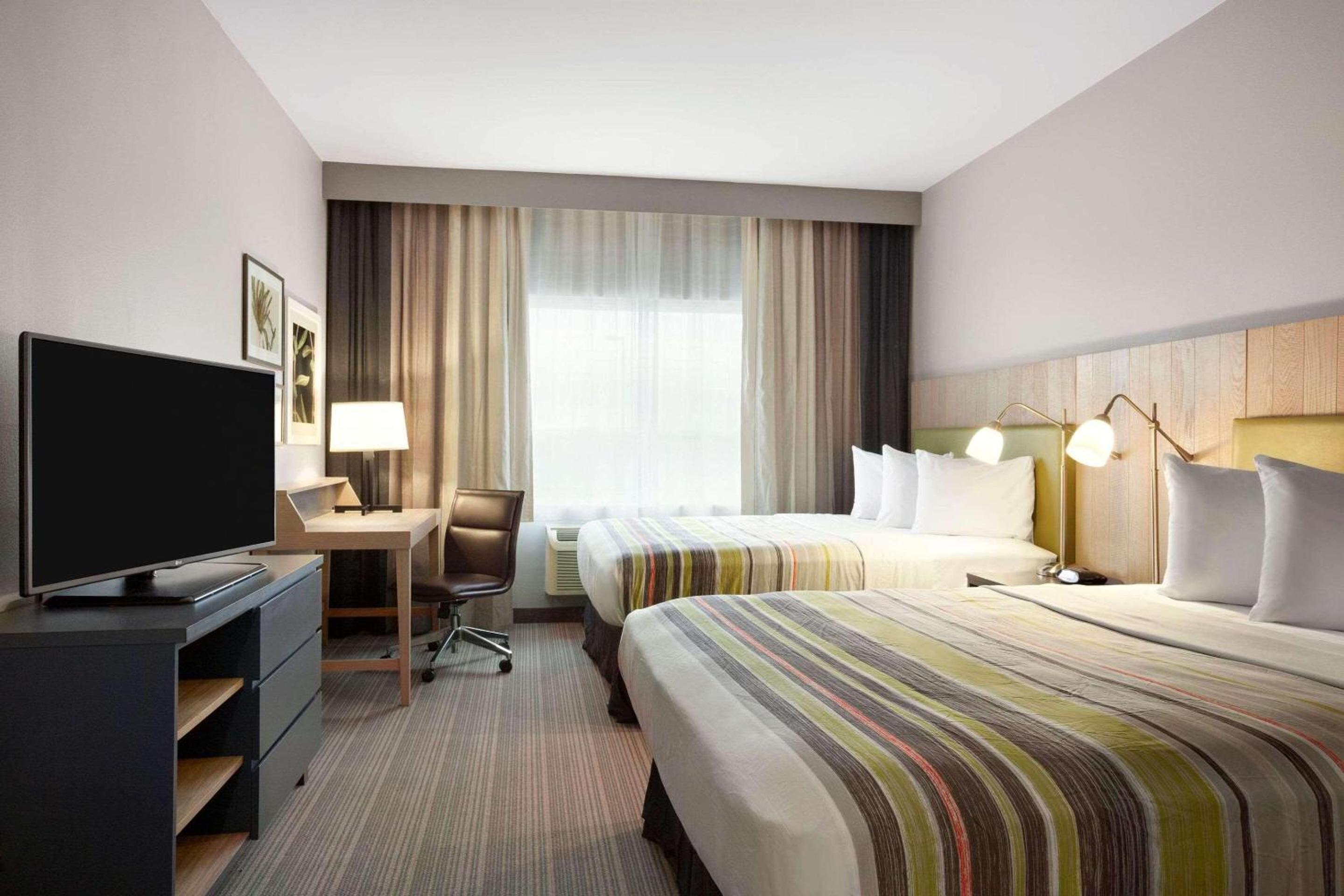 Queen Room with Two Queen Beds - Photo 1