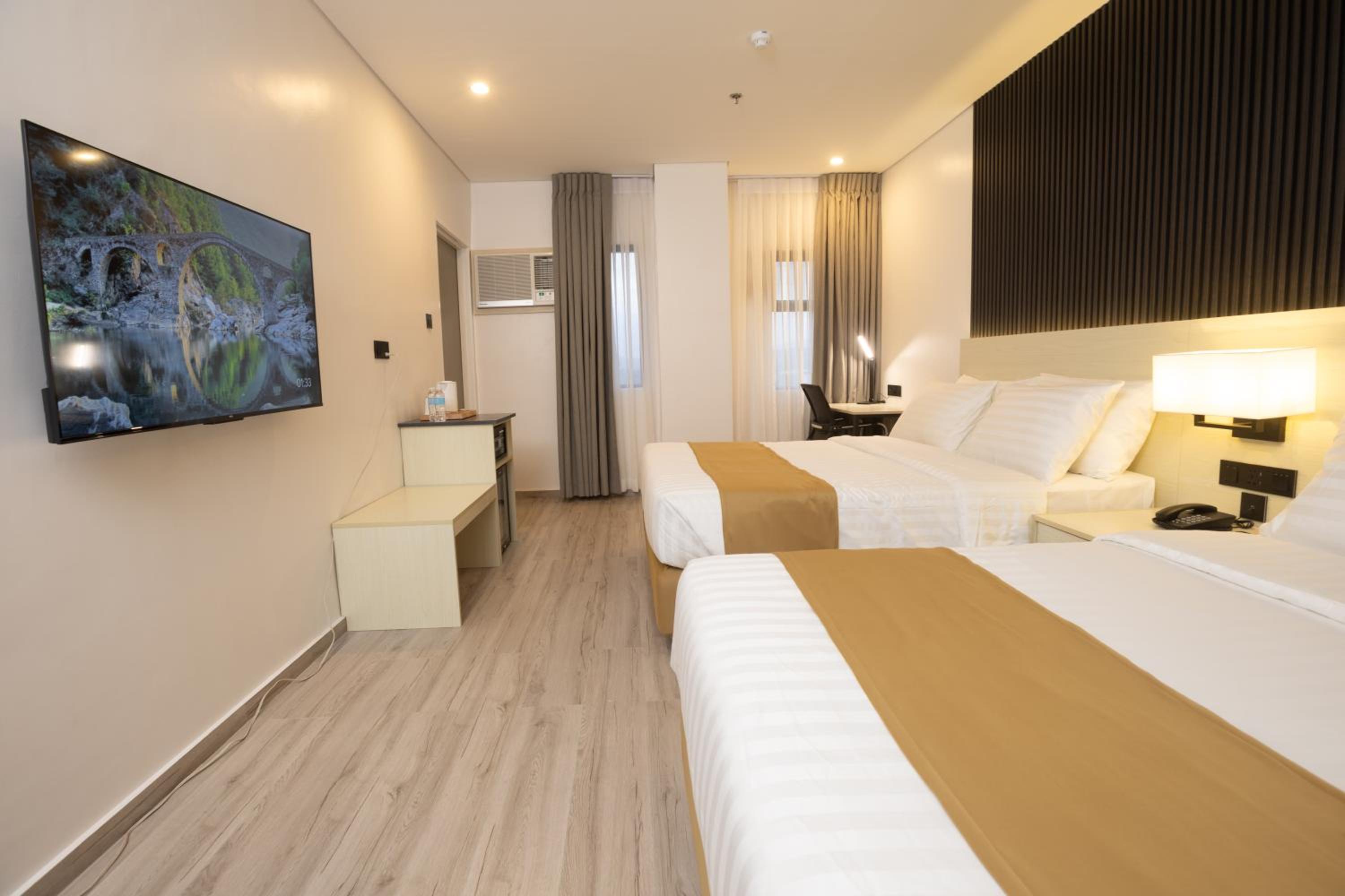 Deluxe Queen Room with Two Queen Beds photo 1