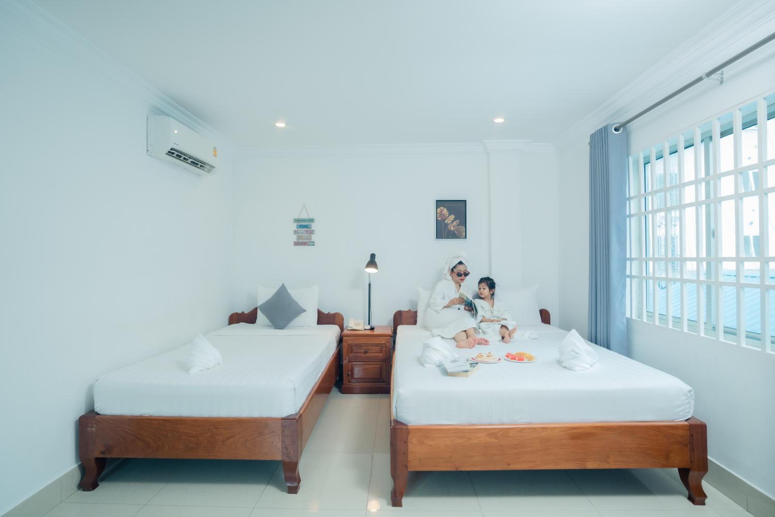 Deluxe Triple Room - Photo 8