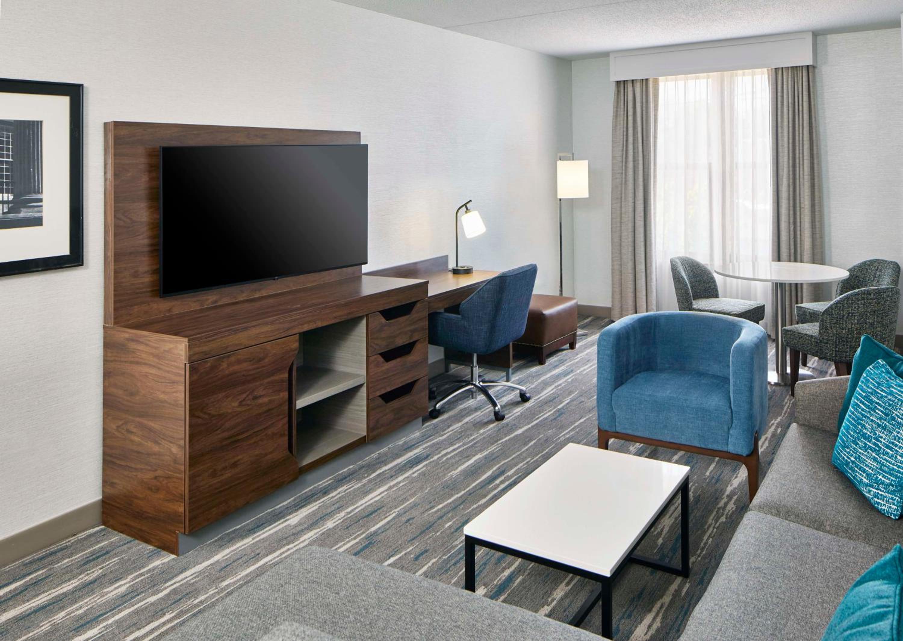 Deluxe King Suite Sofa Bed and Dining Area - Photo 1