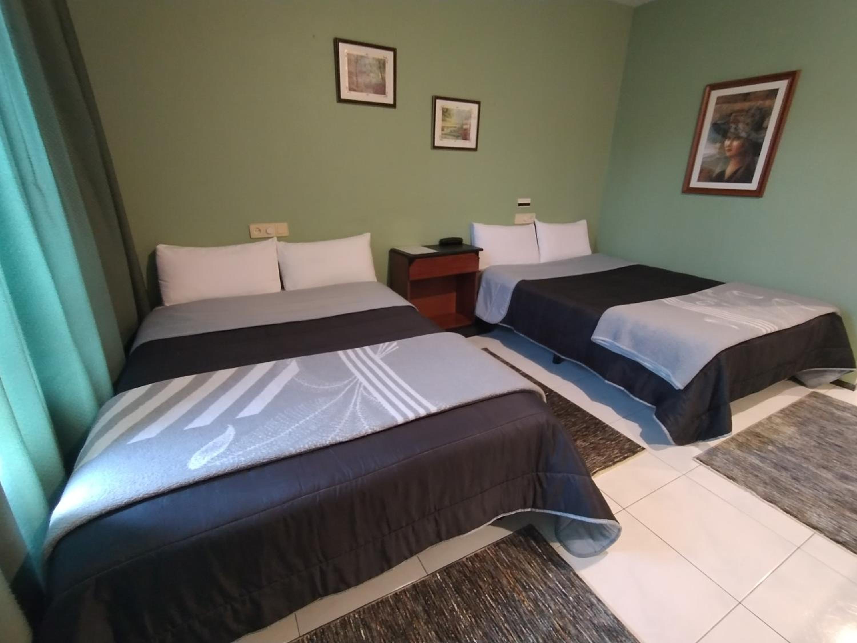 Habitación Doble con Dos Camas Dobles