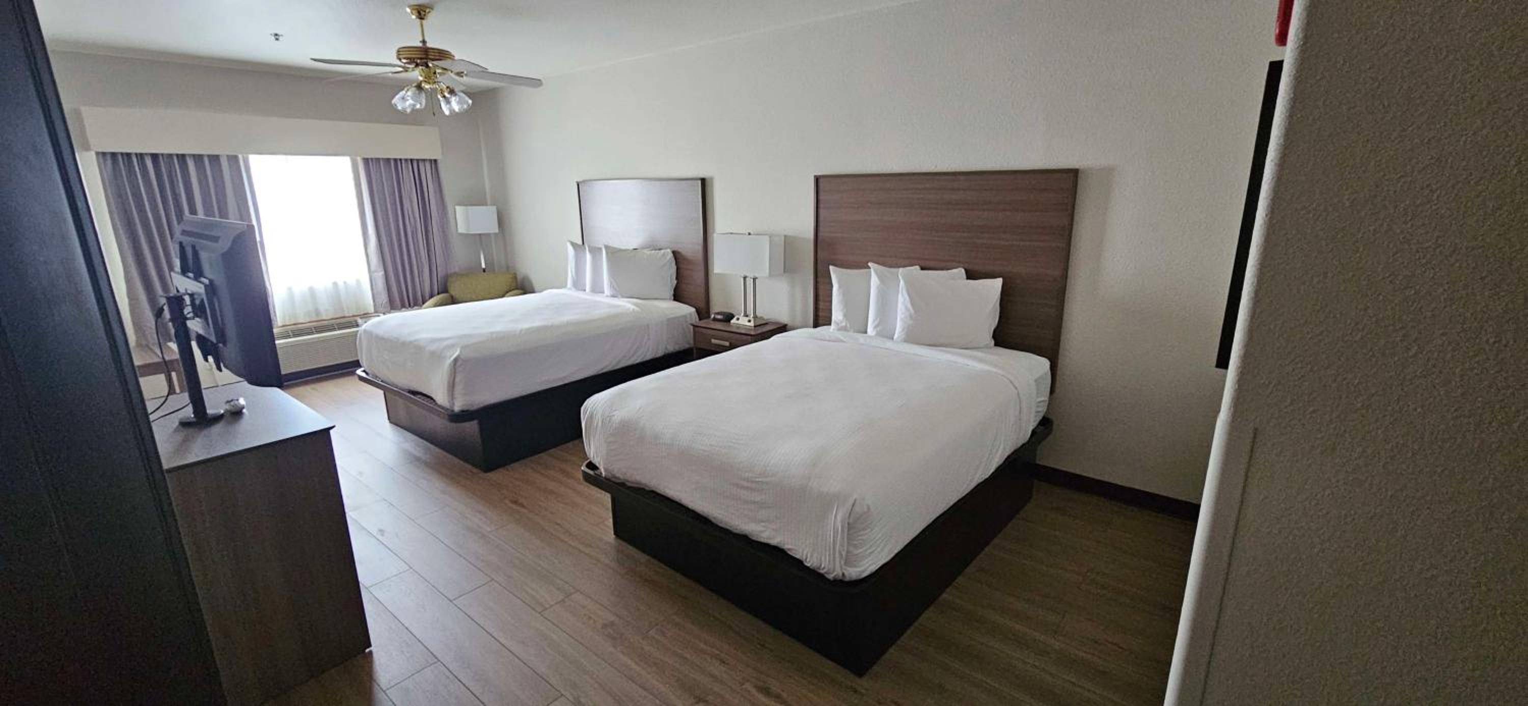One-Bedroom Queen Suite with Two Queen Beds, Living Area and Walk-In Shower - Non-Smoking