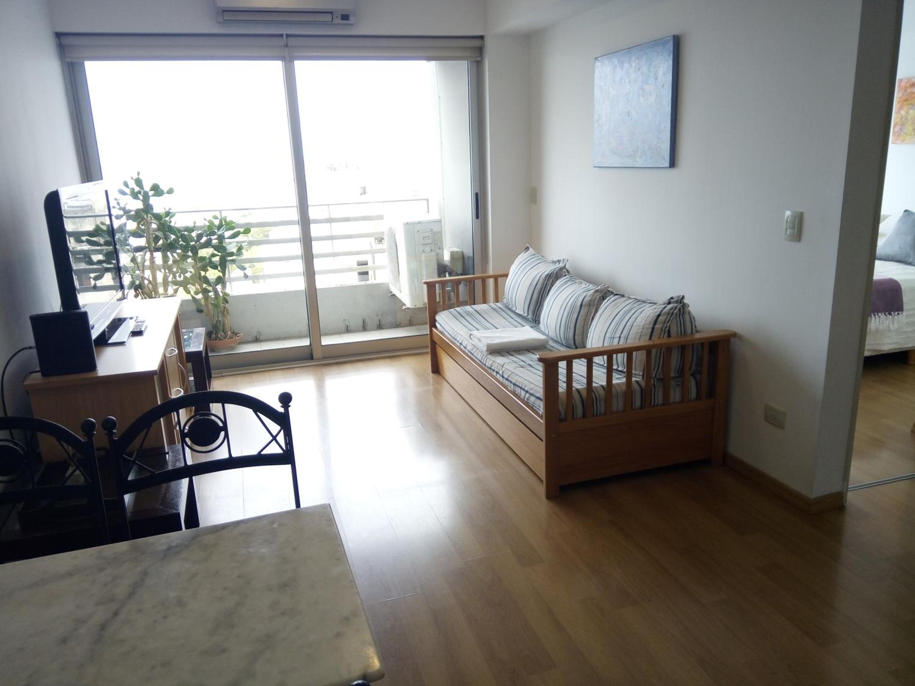 One-Bedroom Apartment with Balcony and City View