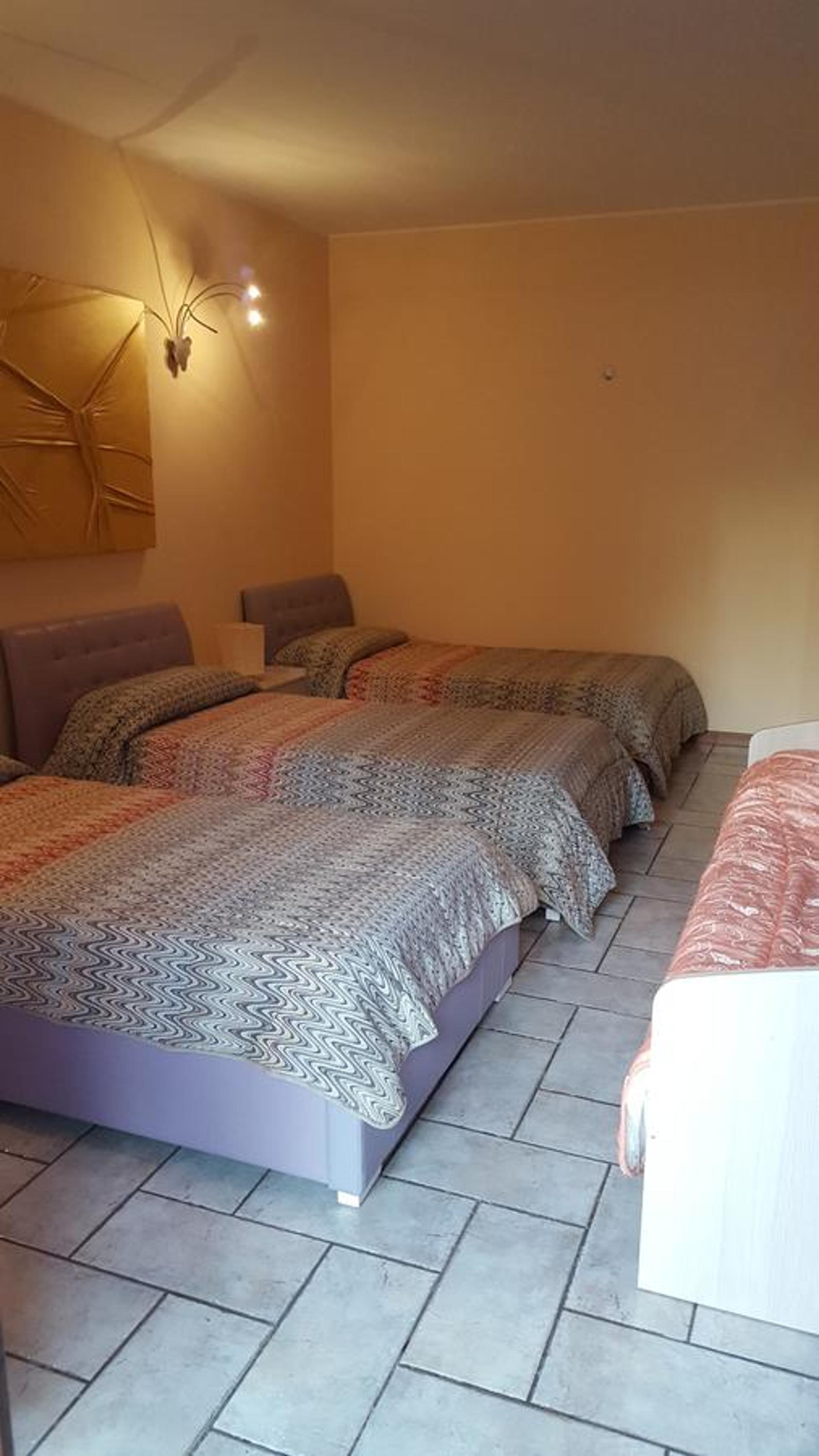 Quadruple Room with Private Bathroom