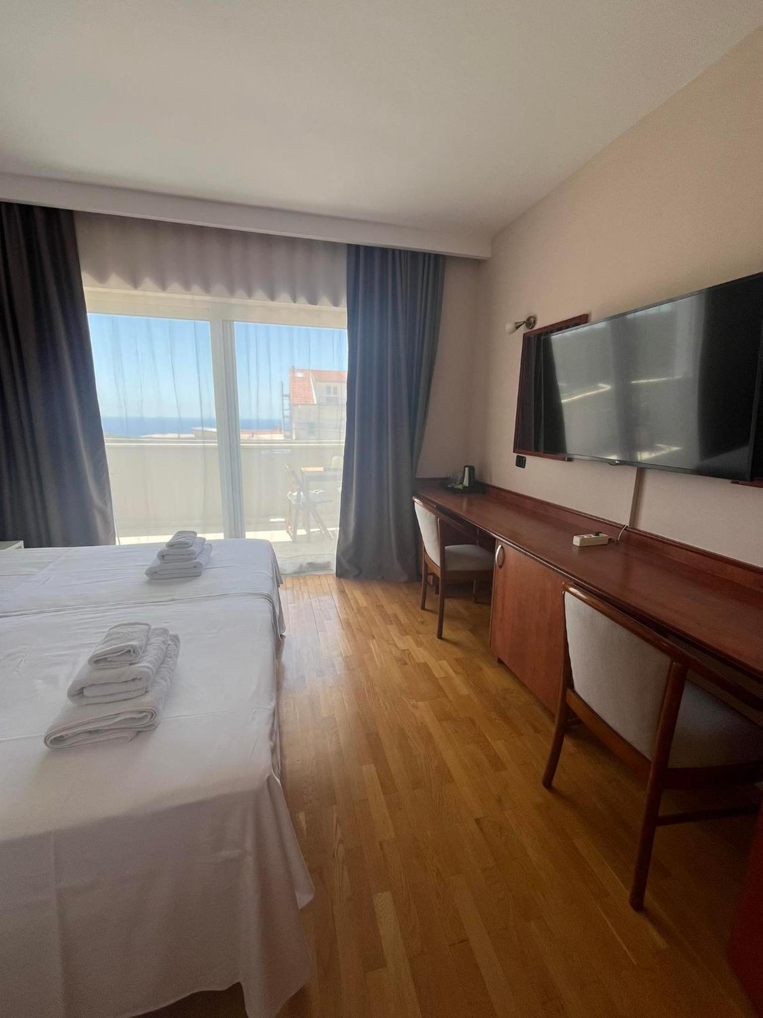 Double or Twin Room with Side Sea View photo 1