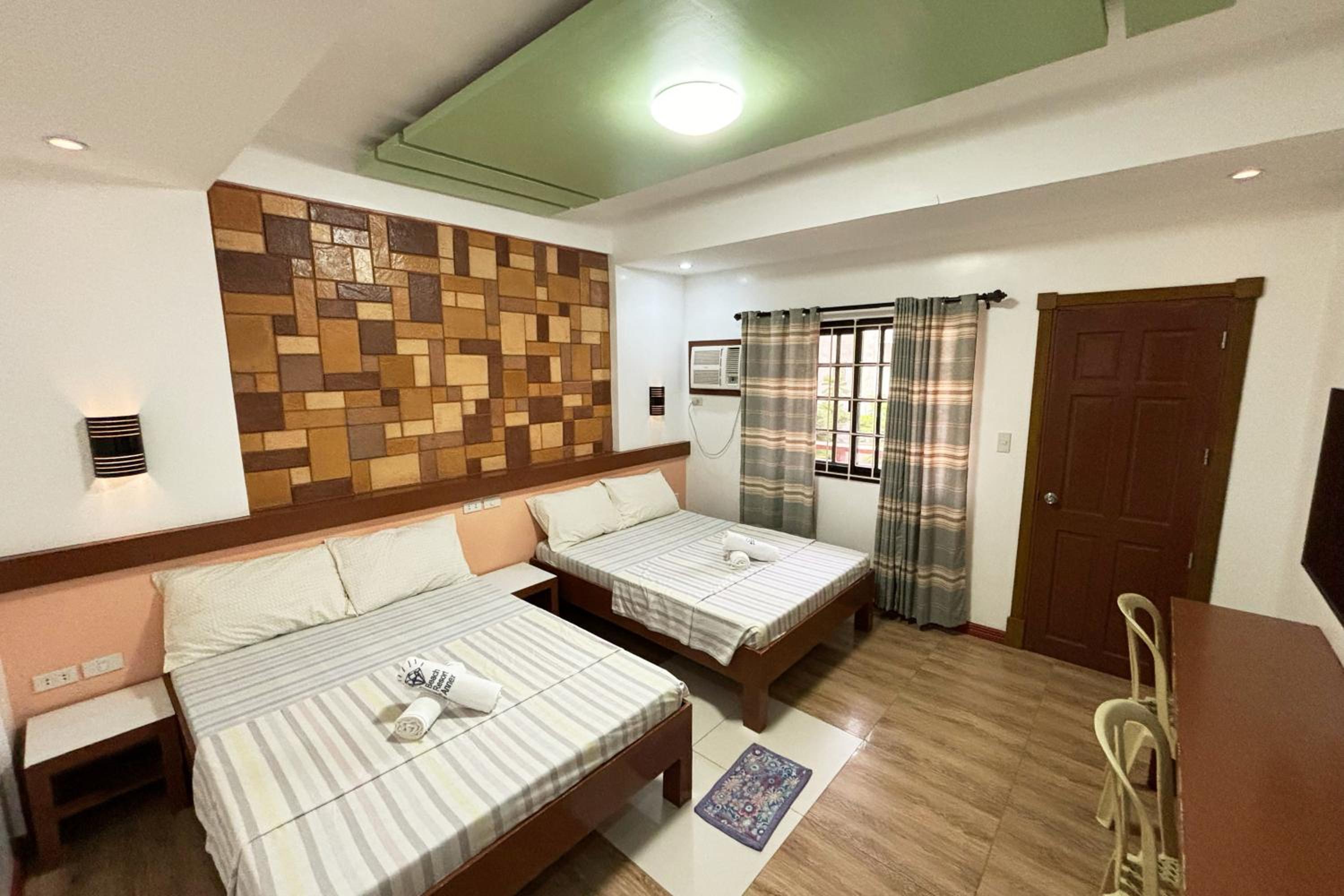 Deluxe Quadruple Room - Photo 16