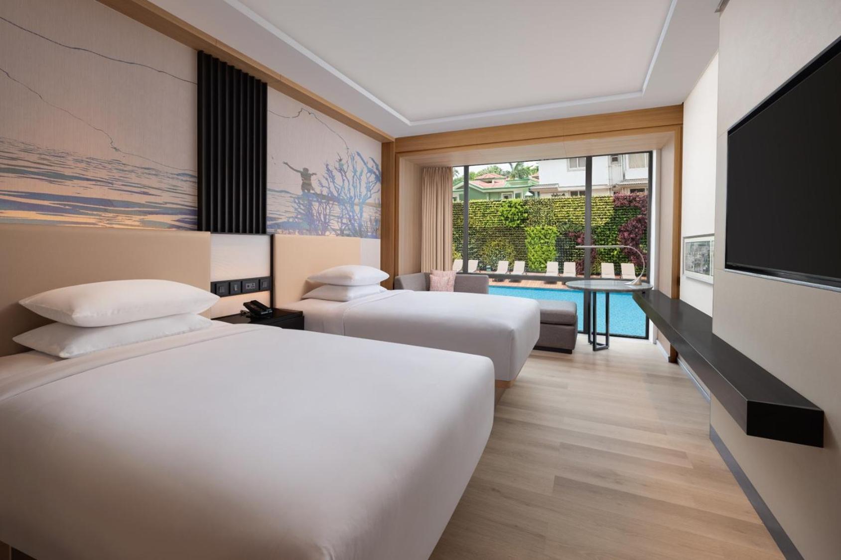 Deluxe Guest room, 2 Queen, Partial pool view with INR 500 Spa credit on min therapy of 60 mins per stay - Photo 2