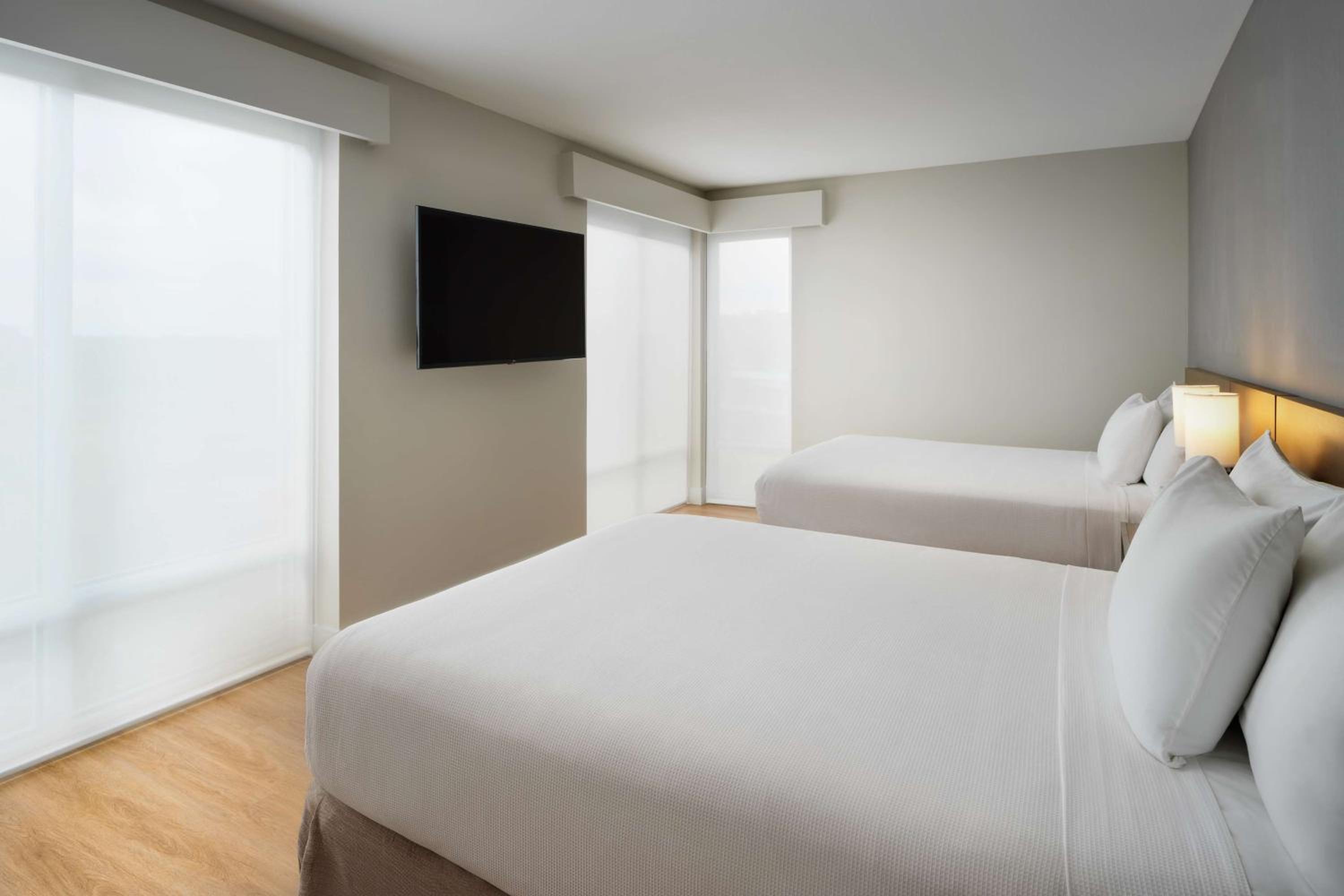 Queen Room with Two Queen Beds and Sofa Bed - Photo 2