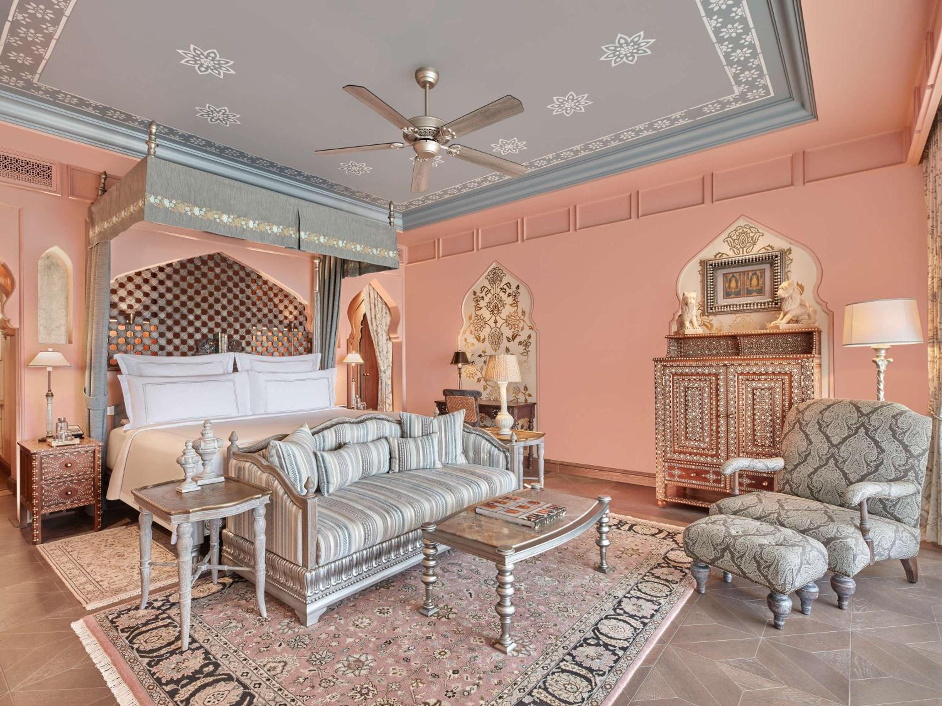 Maharani One King Bedroom Royal Suite with Pool: Airport Transfers in luxury vehicle, 01 Bottle of wine, INR 5000 hotel credit once during the stay. One 60-minute couple spa therapy. Evening Hi-Tea / Sundowner with Bartender, Butler Service