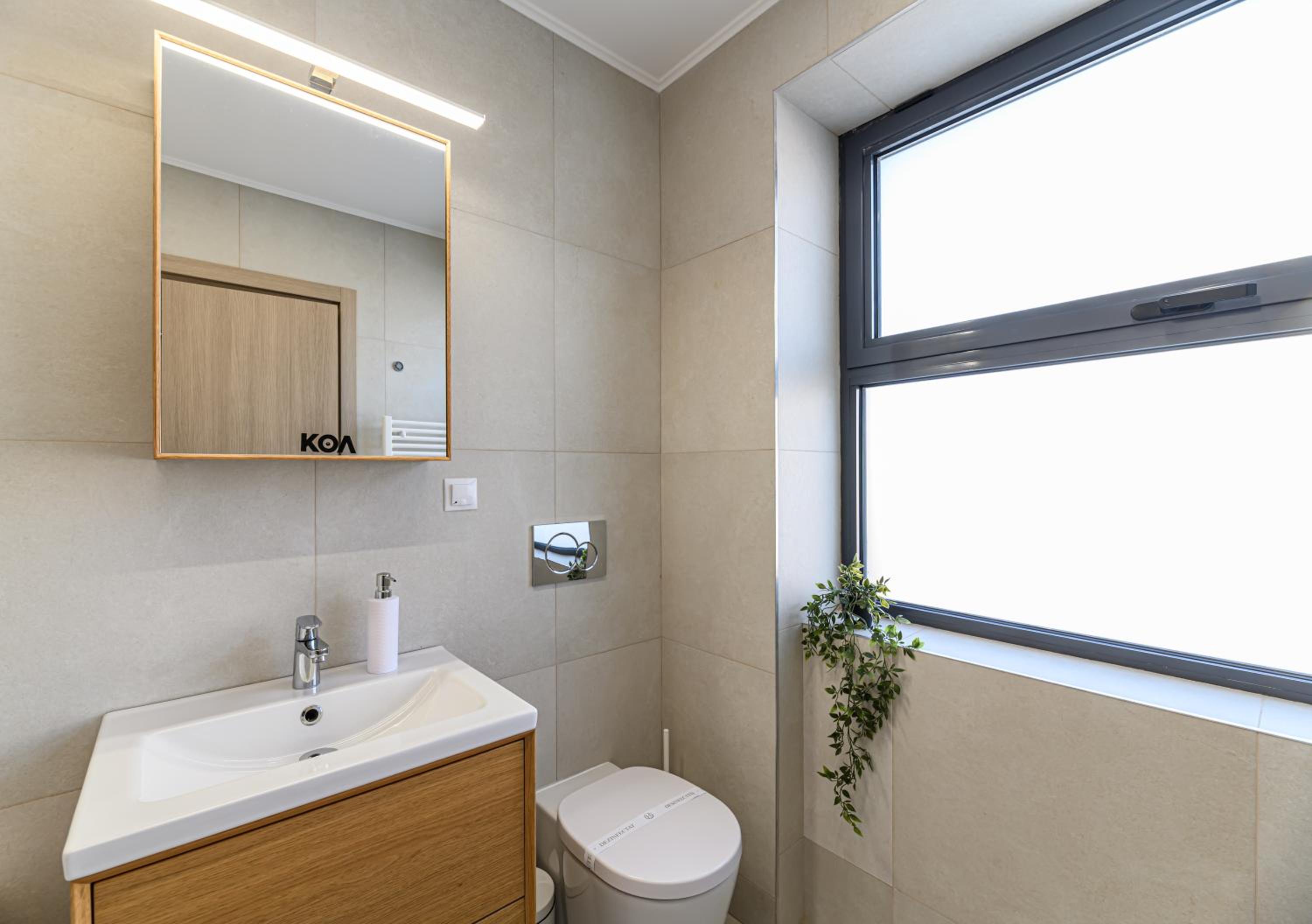 Three-Bedroom Apartment - Photo 2