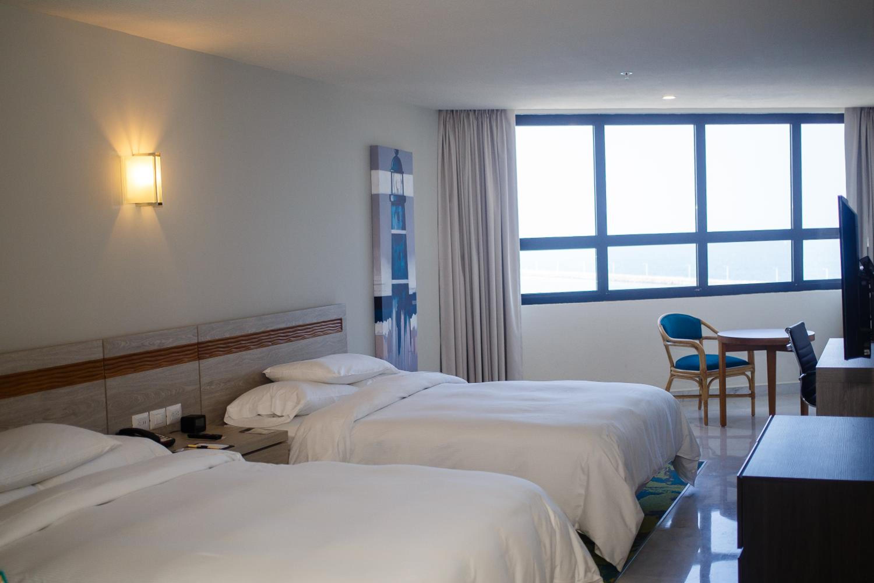 Queen Room with Two Queen Beds and Beach View