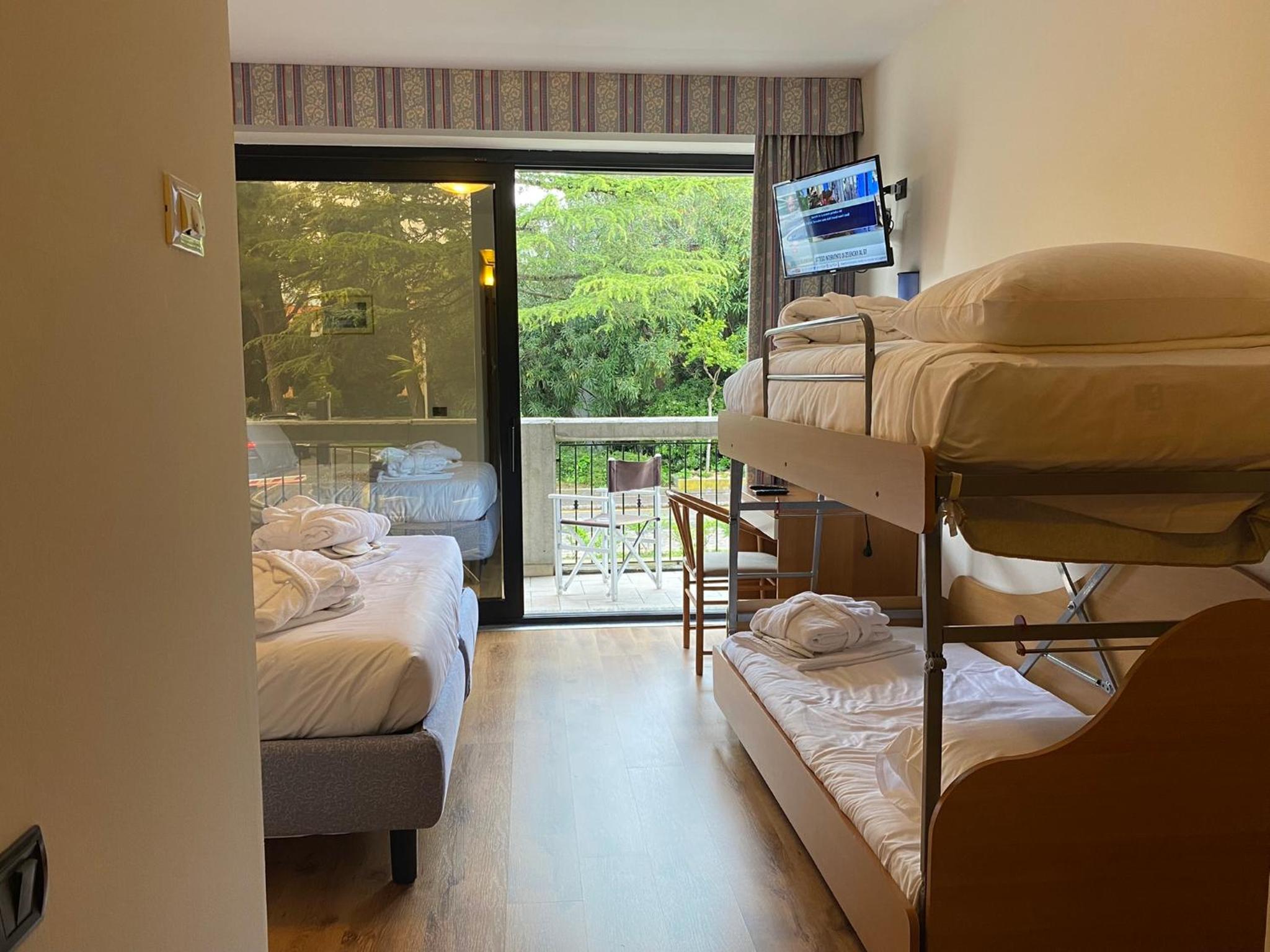 Deluxe Family Room With Balcony And Partial Lake View