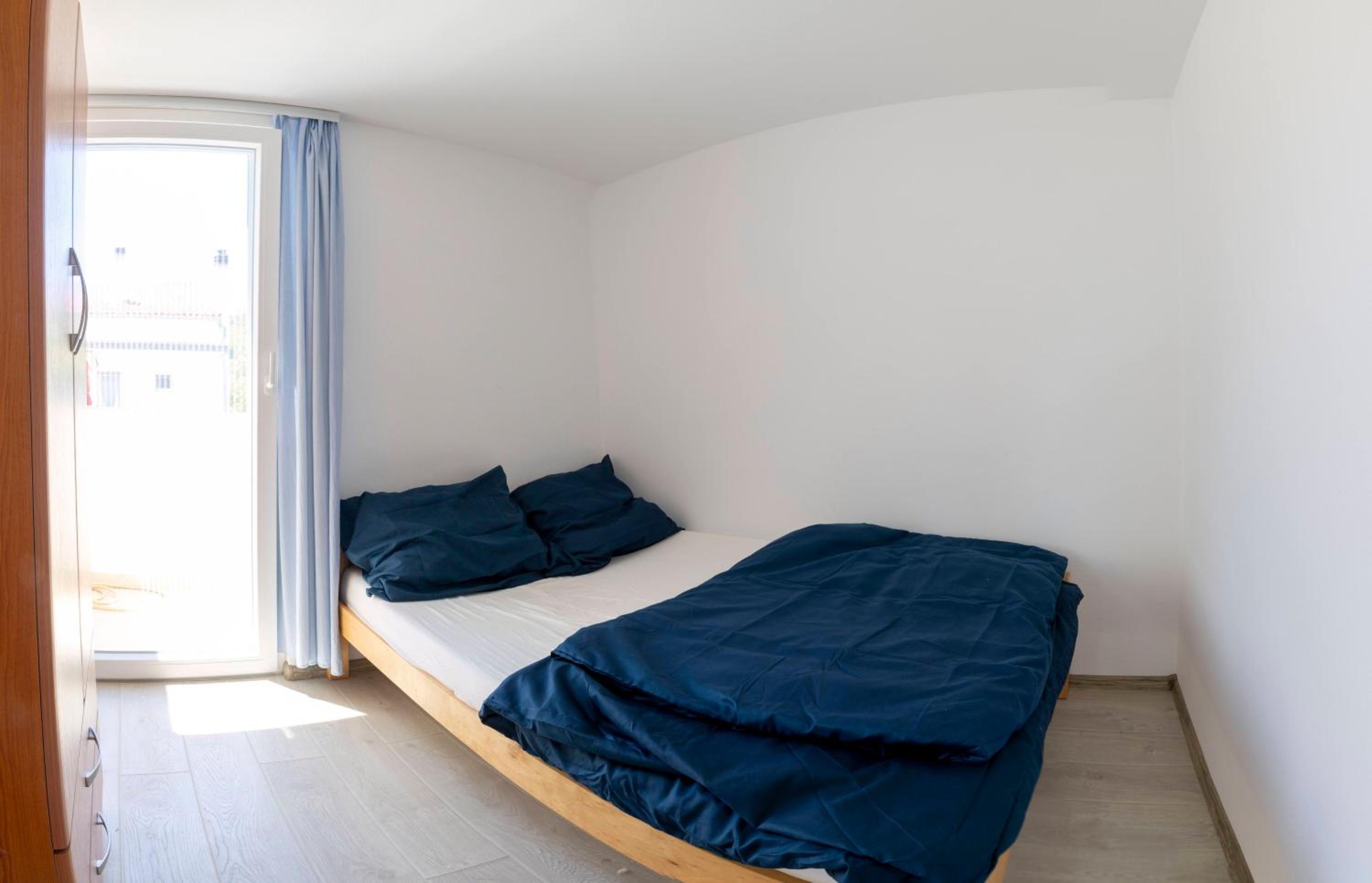 One-Bedroom Apartment with Balcony and City View
