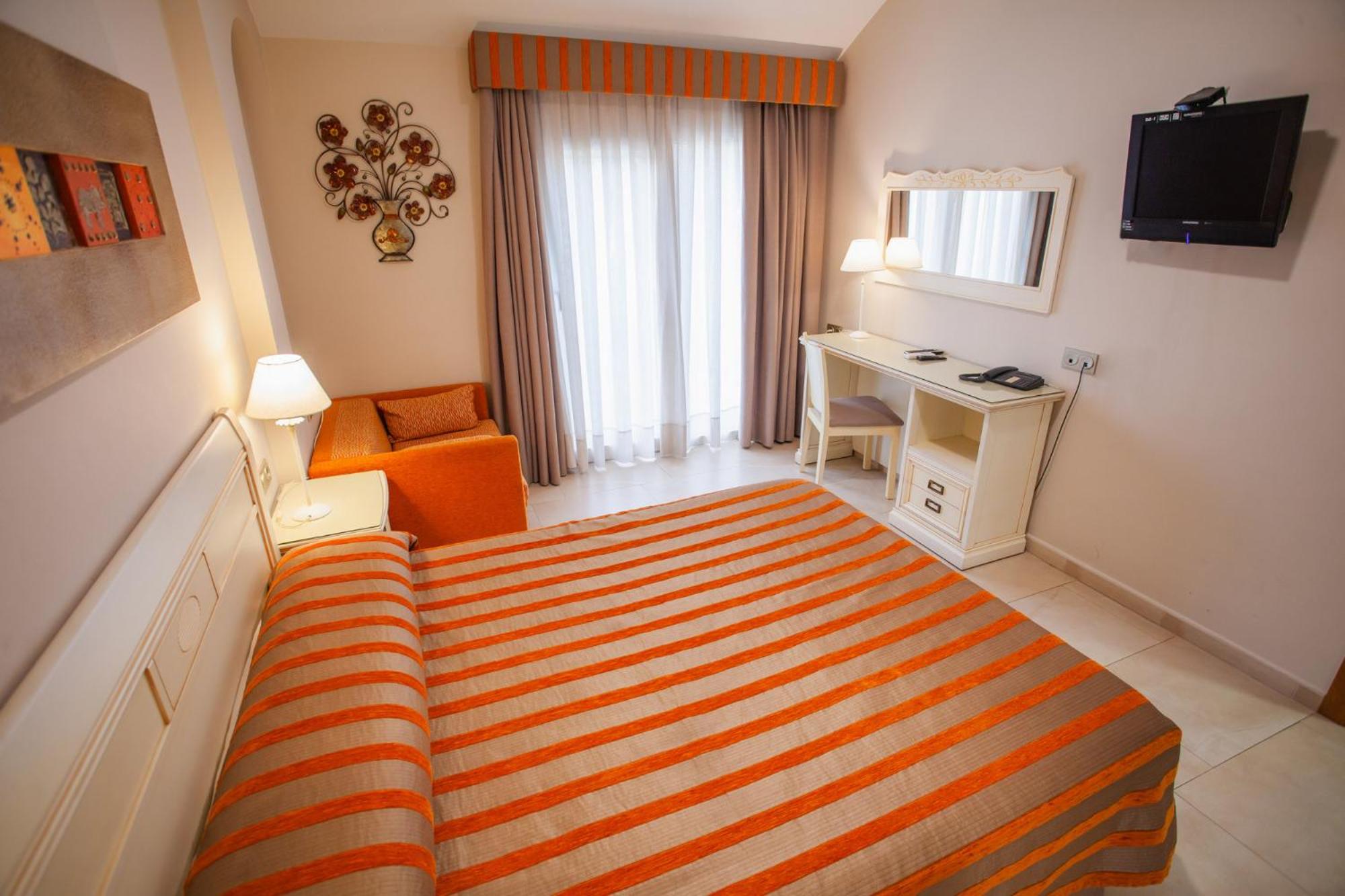 Habitación Doble Deluxe (2 Adultos + 1 Niño)