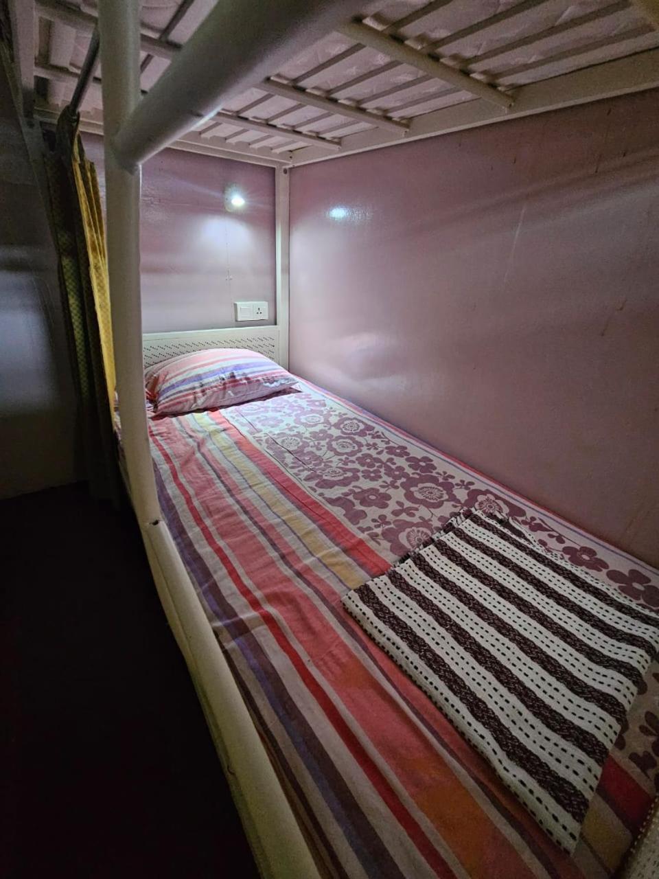 Single Bed In Male Dormitory Room