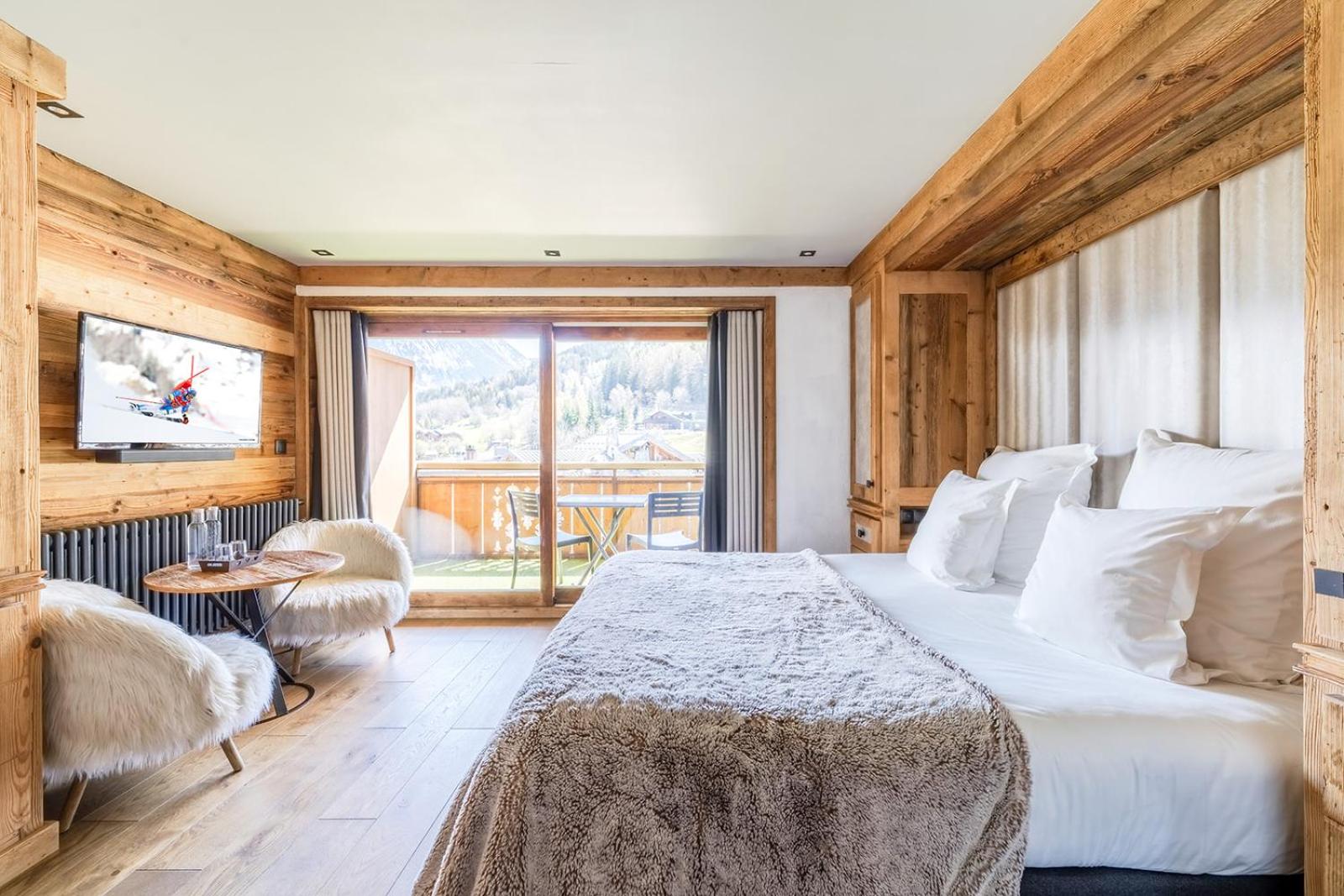 Comfort room with balcony and village view