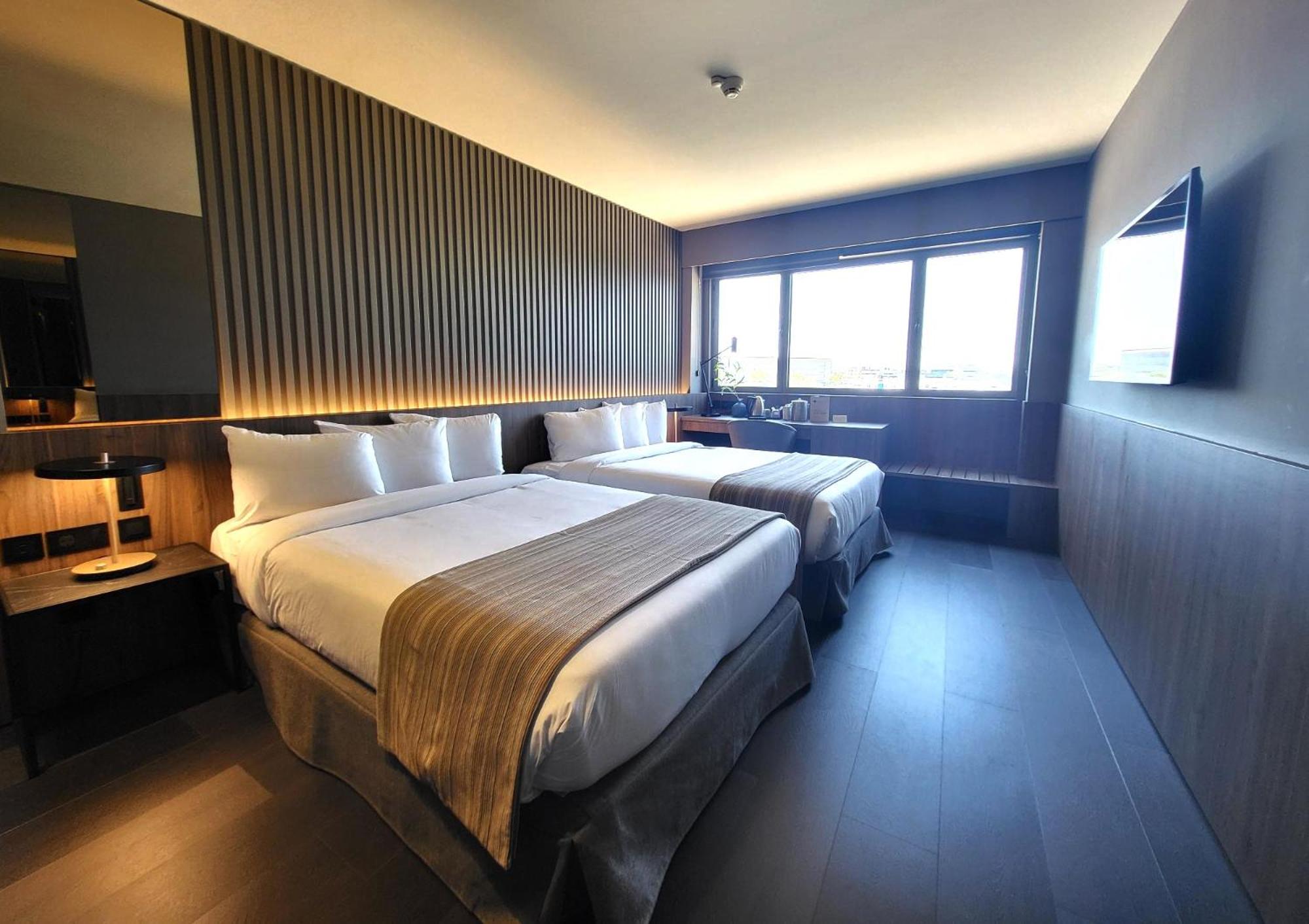 Habitación Doble Deluxe con Dos Camas Dobles