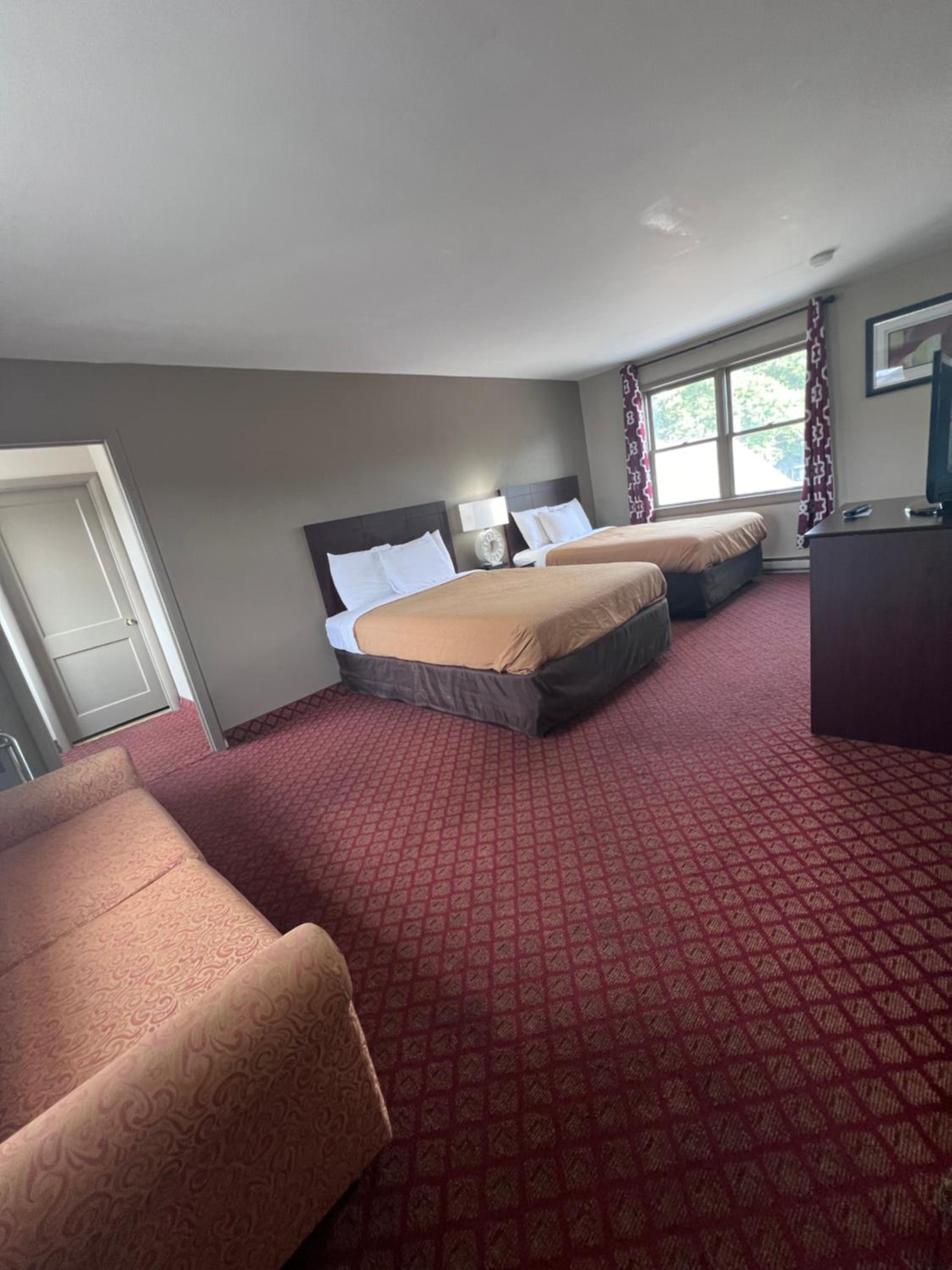 King Suite with One King Bed and Two Double Beds - Non Smoking photo 1