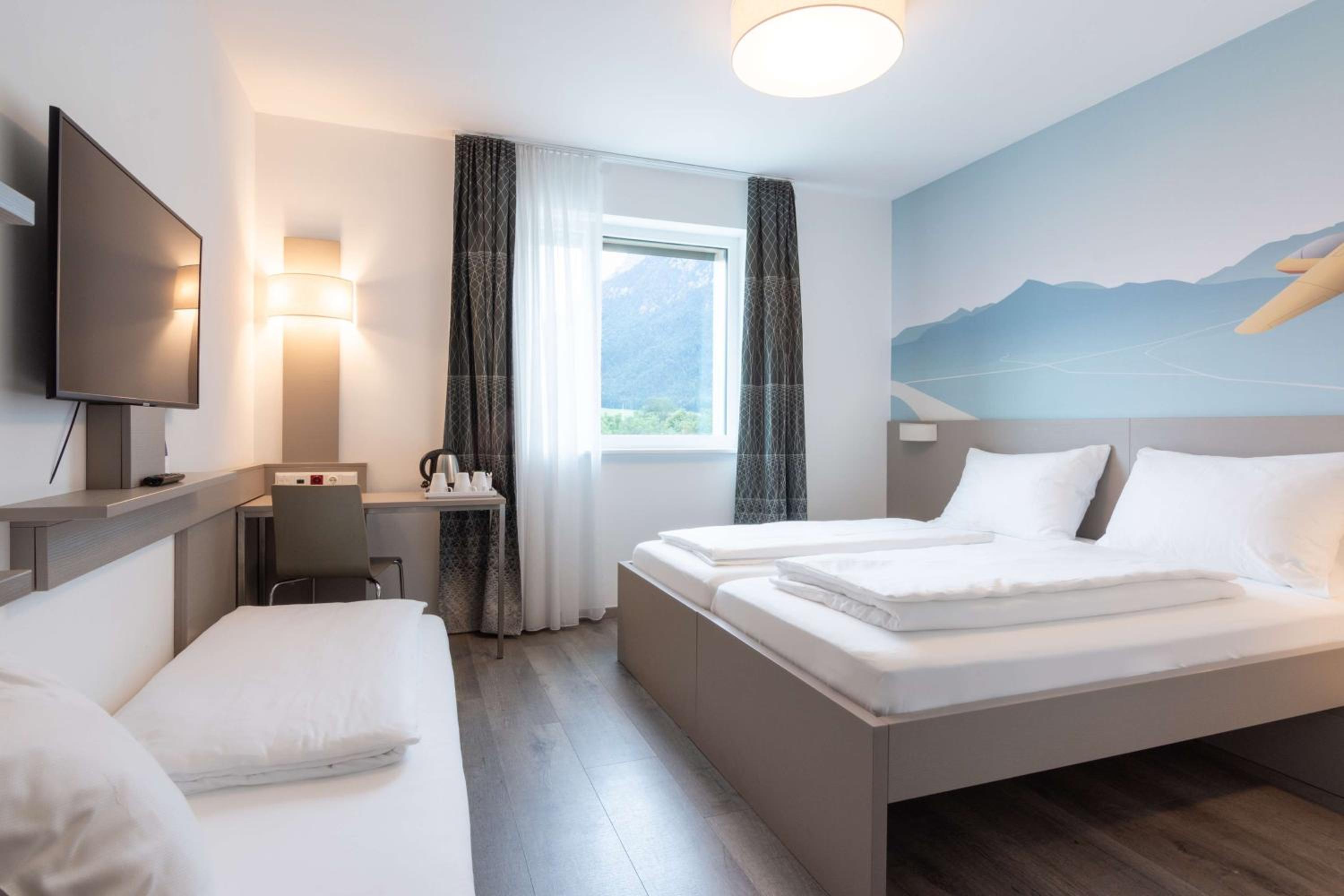 Standard Triple Room with 1 Double and 1 Twin Bed - Photo 1