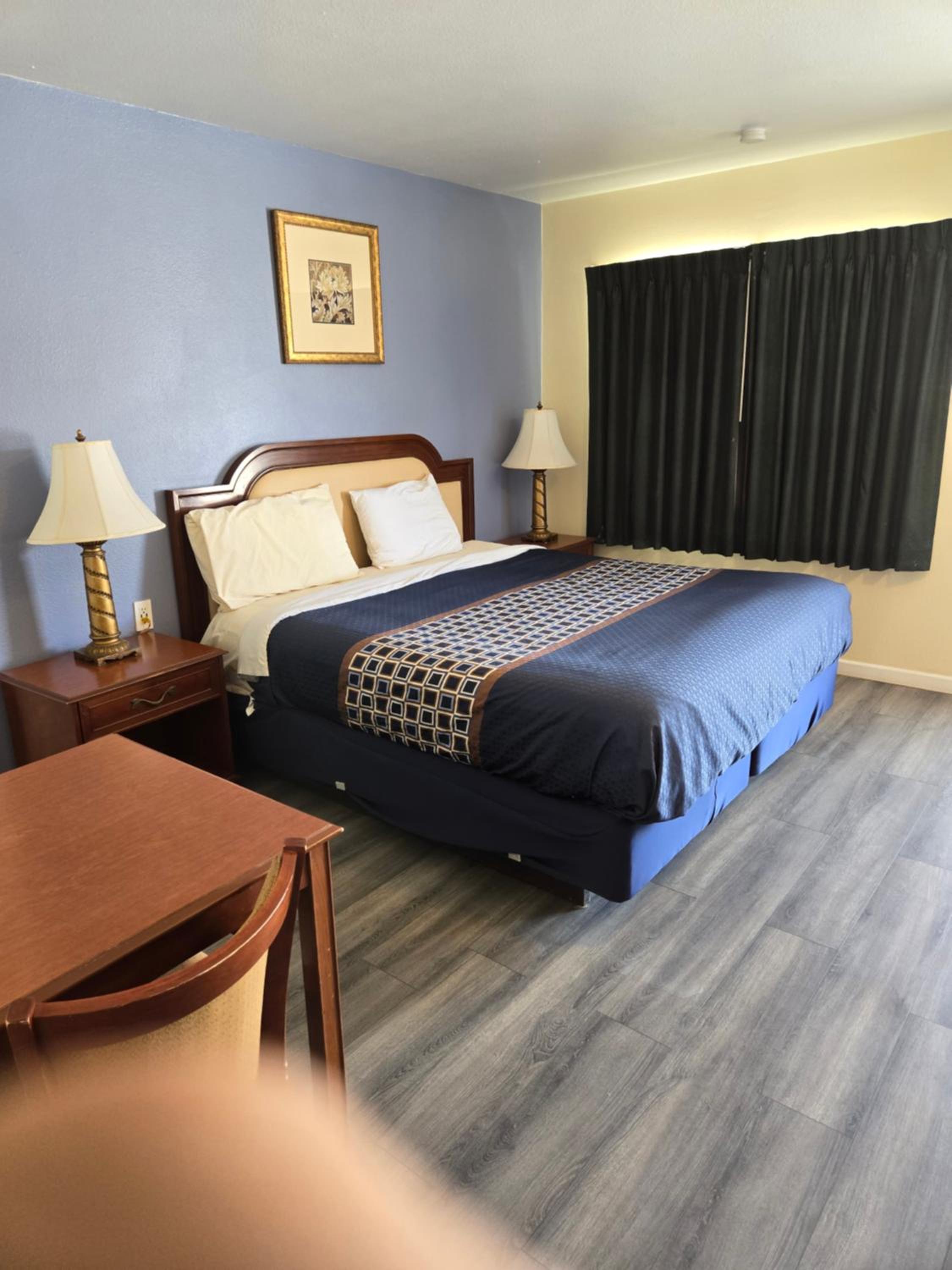 King Suite with One King and Two Double Beds - Non-Smoking photo 2