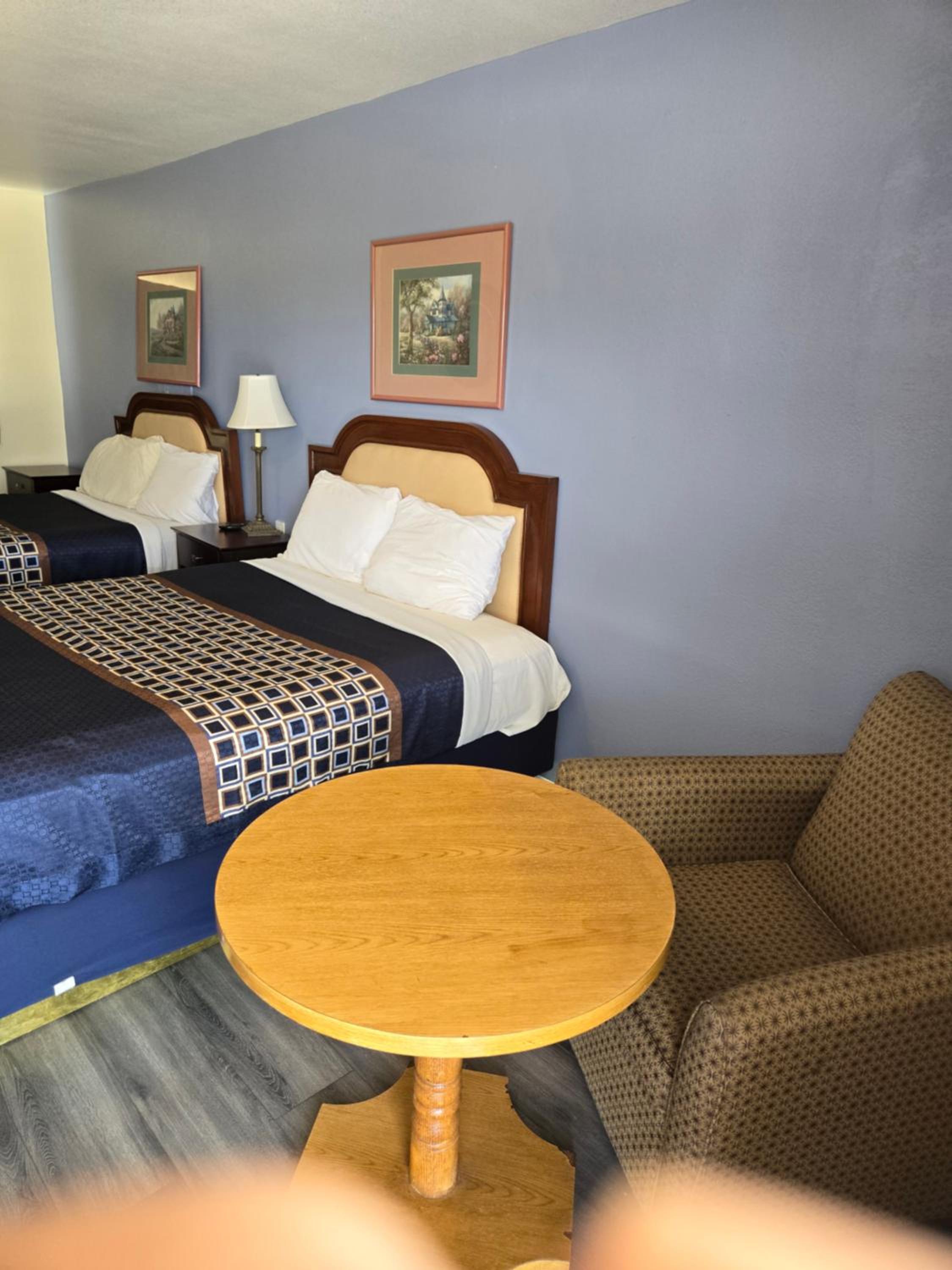 King Suite with One King and Two Double Beds - Non-Smoking photo 1