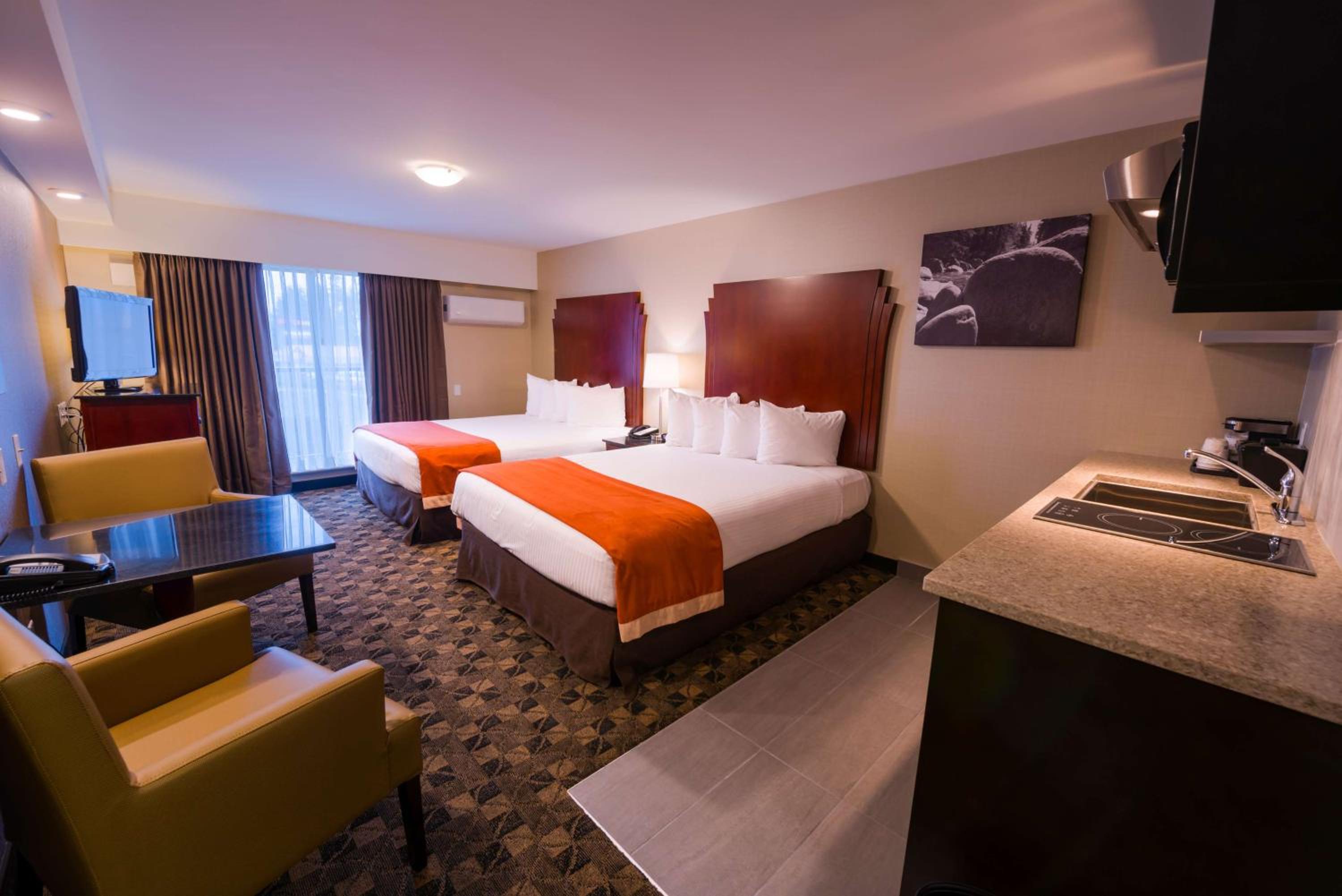 Queen Room with Two Queen Beds with Balcony and Kitchenette - Non-Smoking