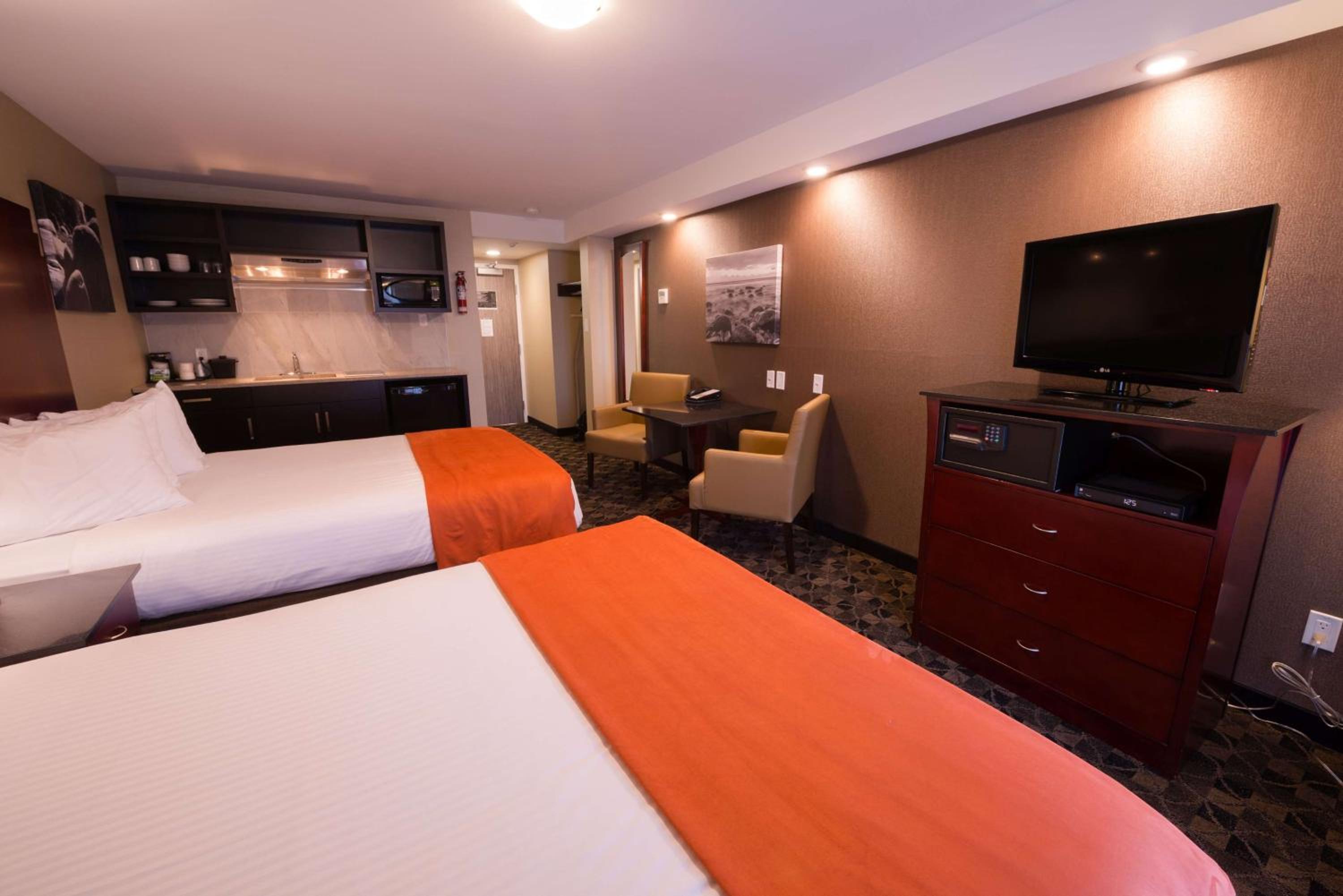 Queen Room with Two Queen Beds with Balcony and Kitchenette - Non-Smoking