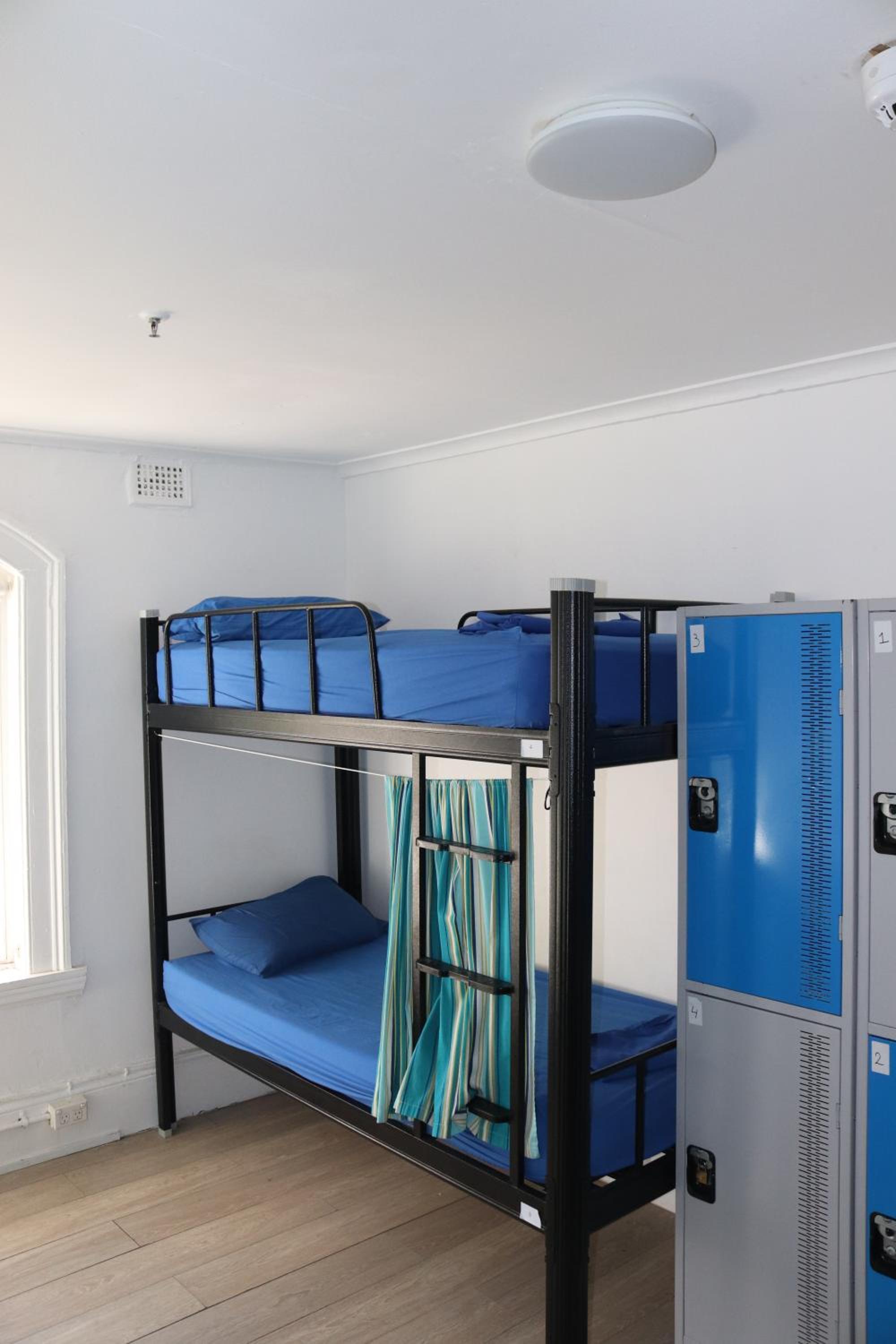 Bed in 8-Bed Dormitory Room with Shared Bathroom (age 18-36 years) photo 1