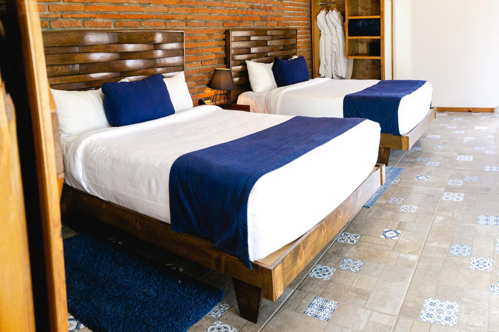 Deluxe Queen Room With Two Queen Beds photo 1