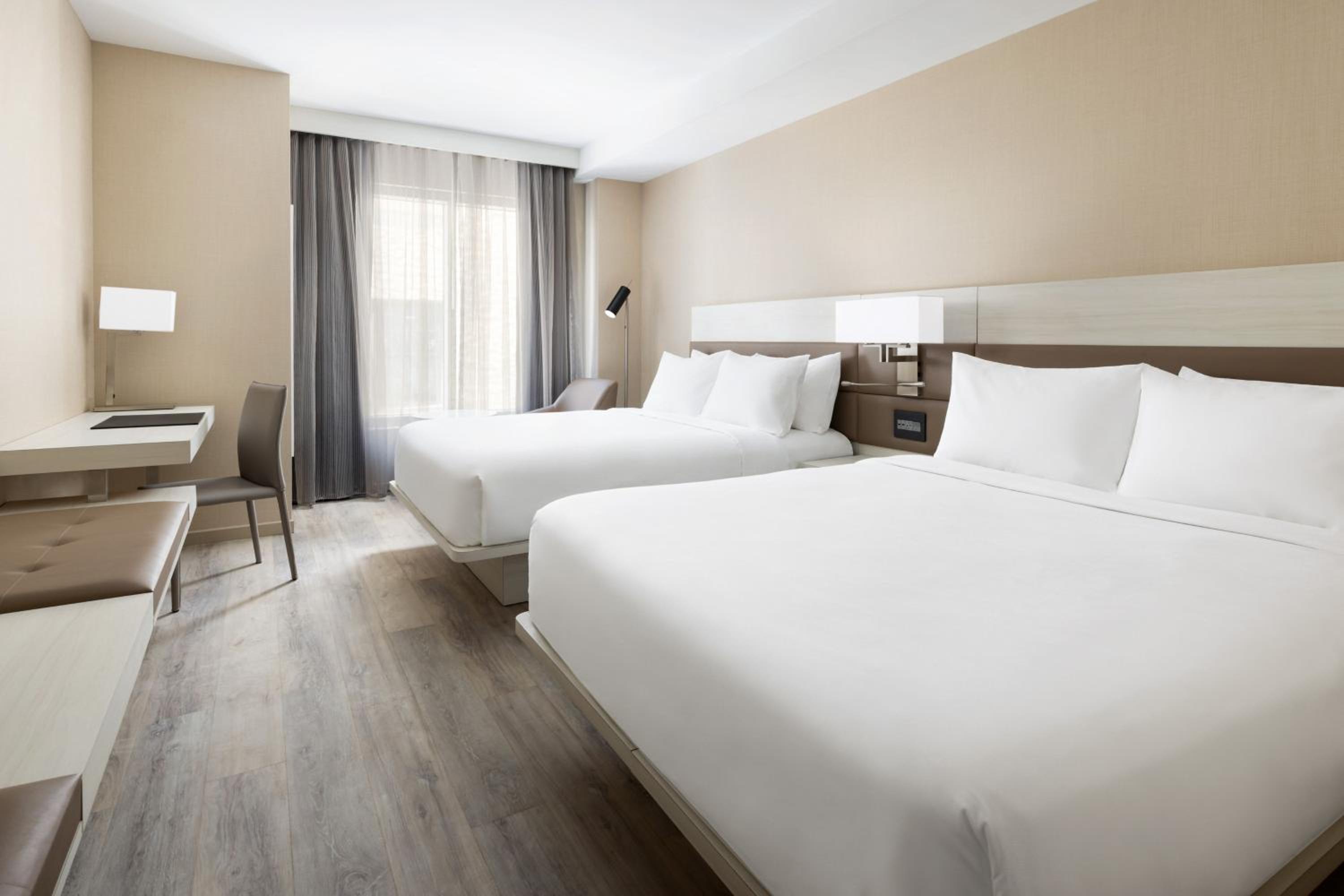 Queen Room with Two Queen Beds - Hearing Accessible - Photo 1