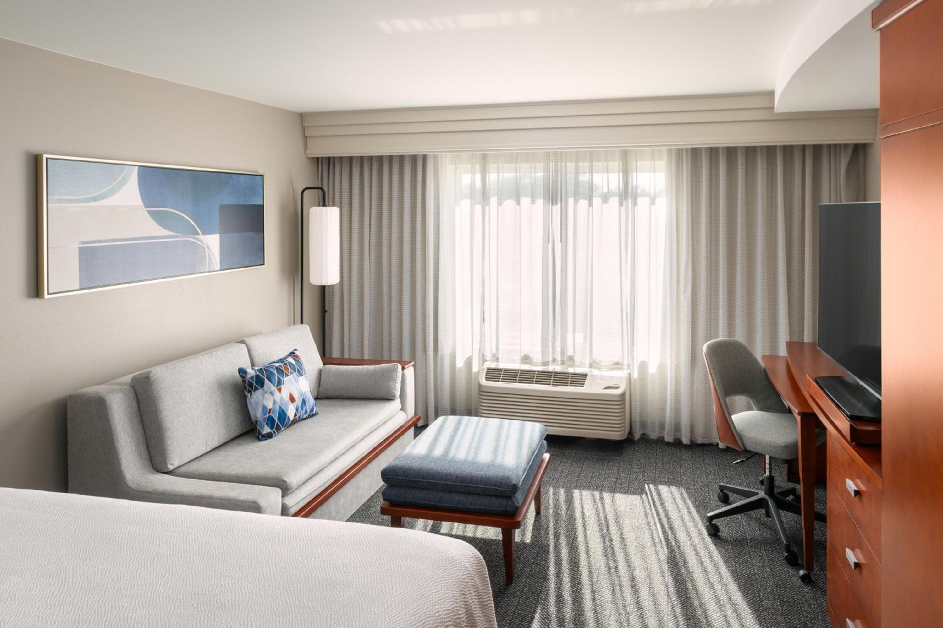 Newly Renovated King Room with Sofa Bed - Mobility/Hearing Accessible with Roll-In Shower - Photo 1