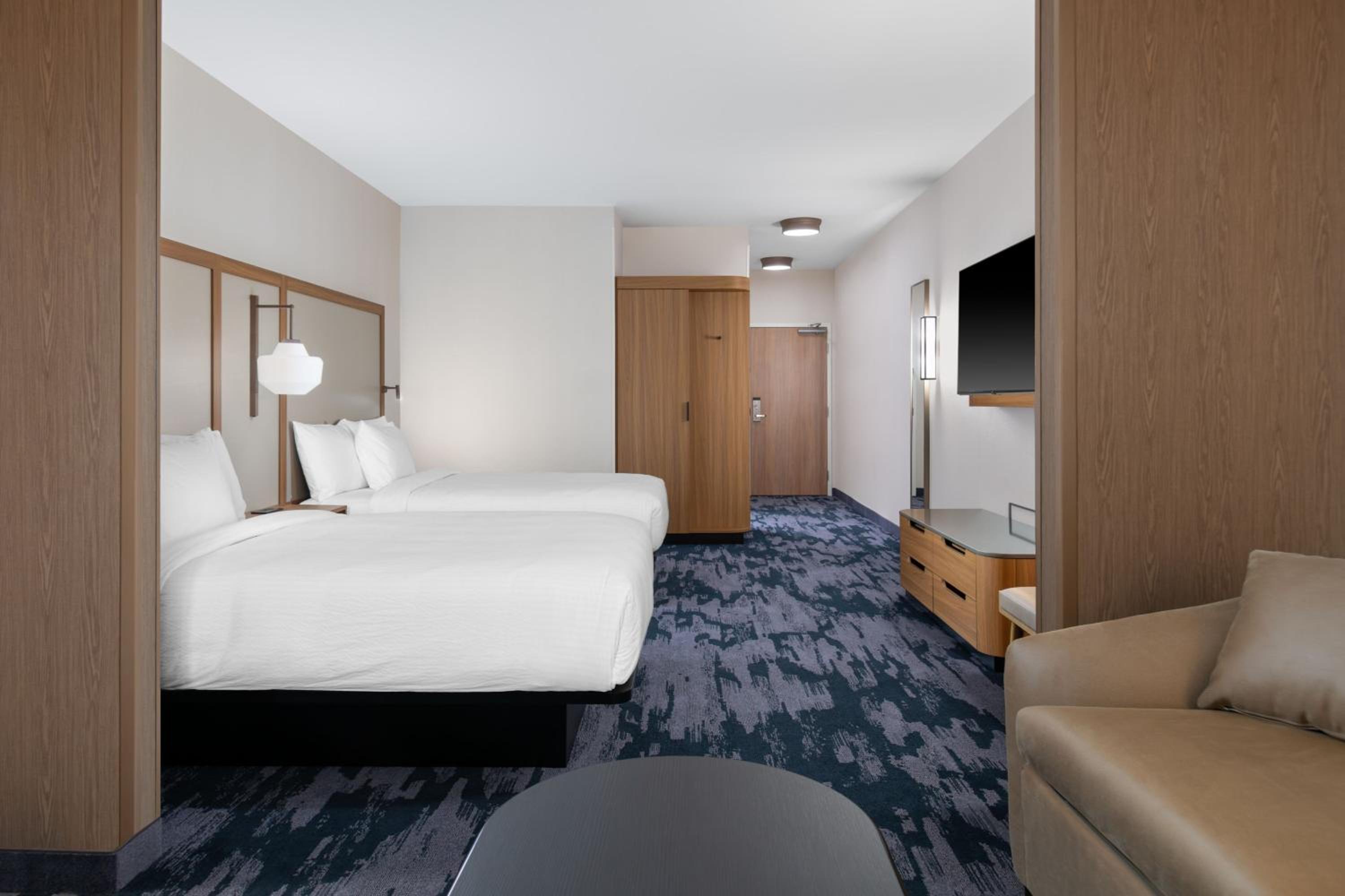 Extended Queen Suite with Two Queen and Sofa Bed - Photo 1
