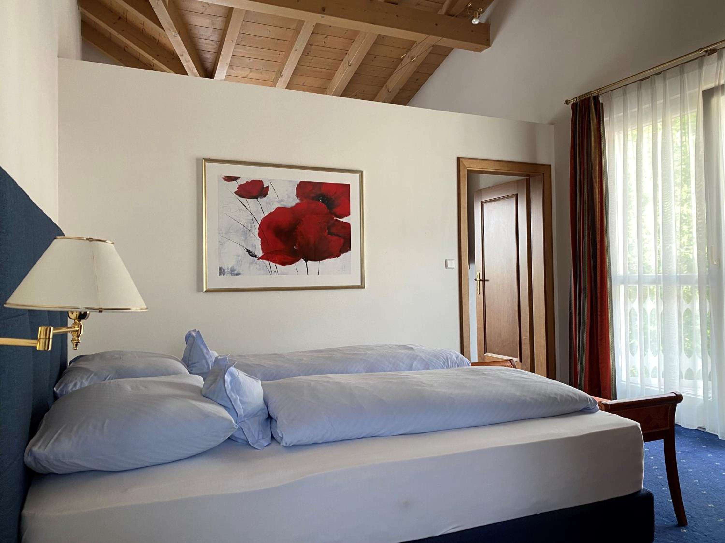 Junior Suite with Balcony and Garden View