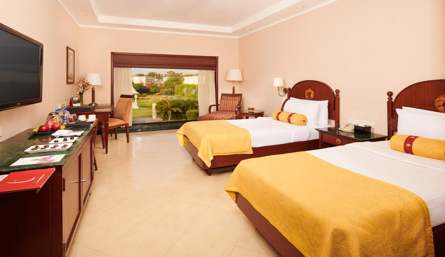 Lalit Garden view Twin Bed (Complimentary Welcome Drink on arrival,15% off on session of couple's Spa,15% off on session of couple's Spa, 15% off on Food & Beverage services, 15% Off on Laundry service for upto 20 clothing item)
