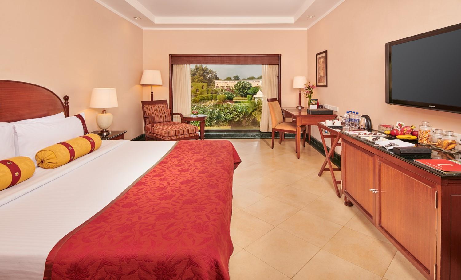 Lalit Garden view King Bed (Complimentary Welcome Drink on arrival,15% off on session of couple's Spa,15% off on session of couple's Spa, 15% off on Food & Beverage services, 15% Off on Laundry service for upto 20 clothing item)