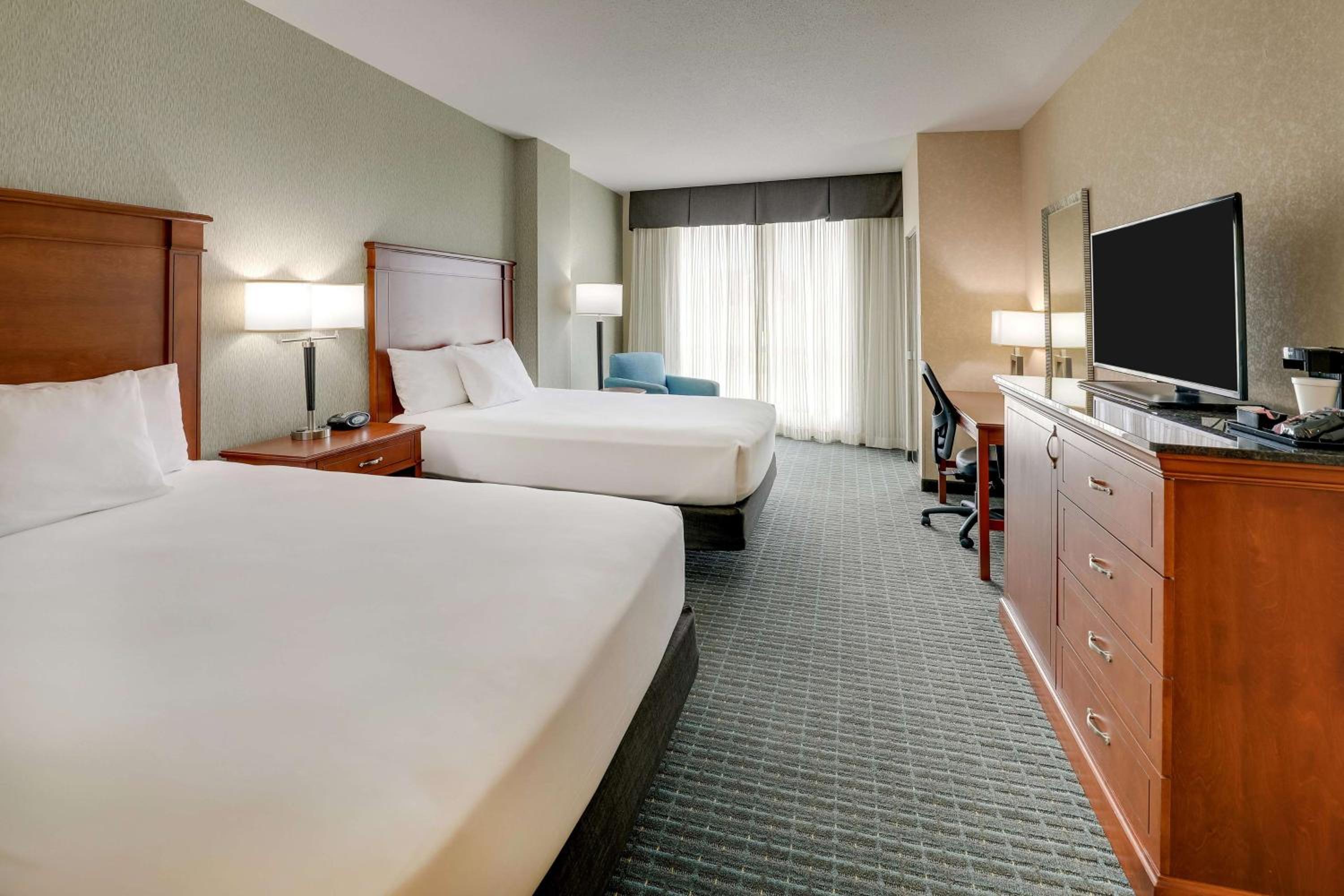 Deluxe Queen Room with Two Queen Beds - Hearing Accessible, Roll-in Shower - Photo 1