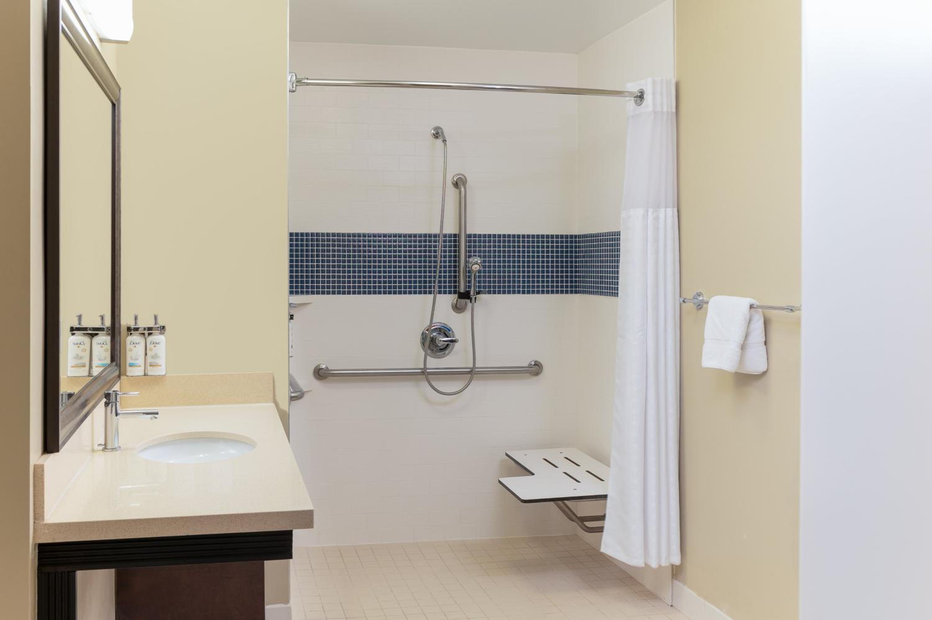 Two-Bedroom Suite with One King and Two Queen Beds - Mobility Accessible Roll-In Shower