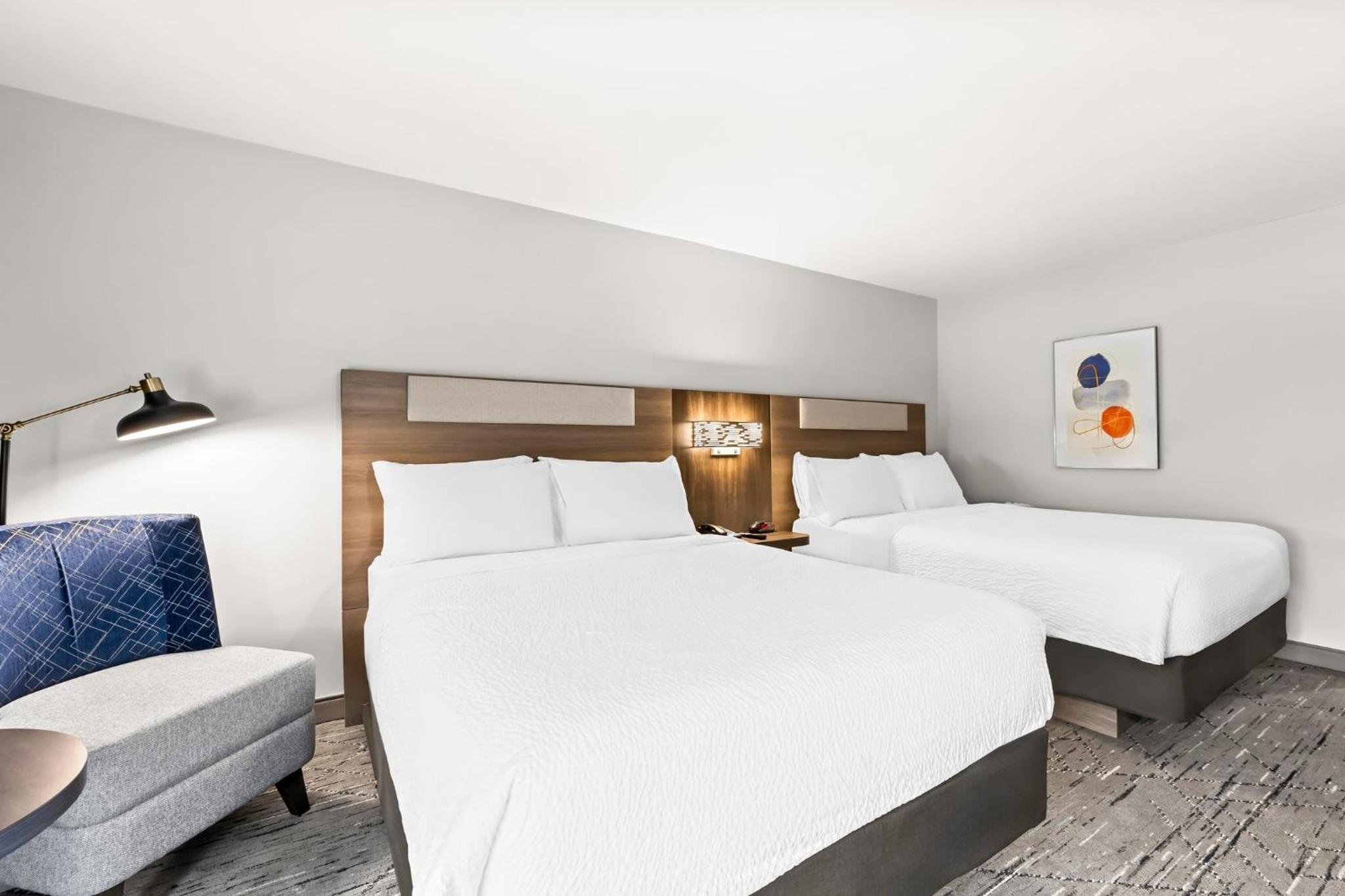 Standard Queen Room with Two Queen Beds and Bath Shower Combo - Photo 1