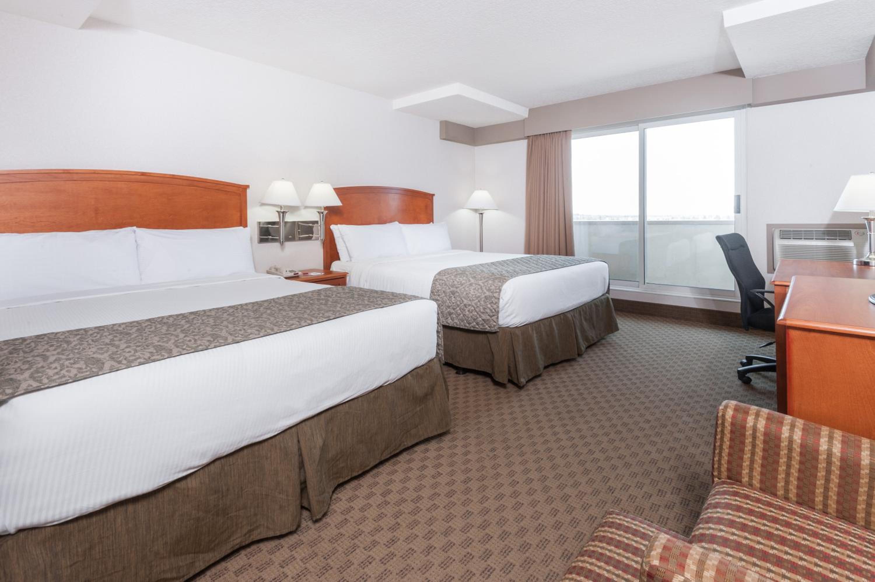 Deluxe Queen Room with Two Queen Beds - Non-Smoking - Photo 1