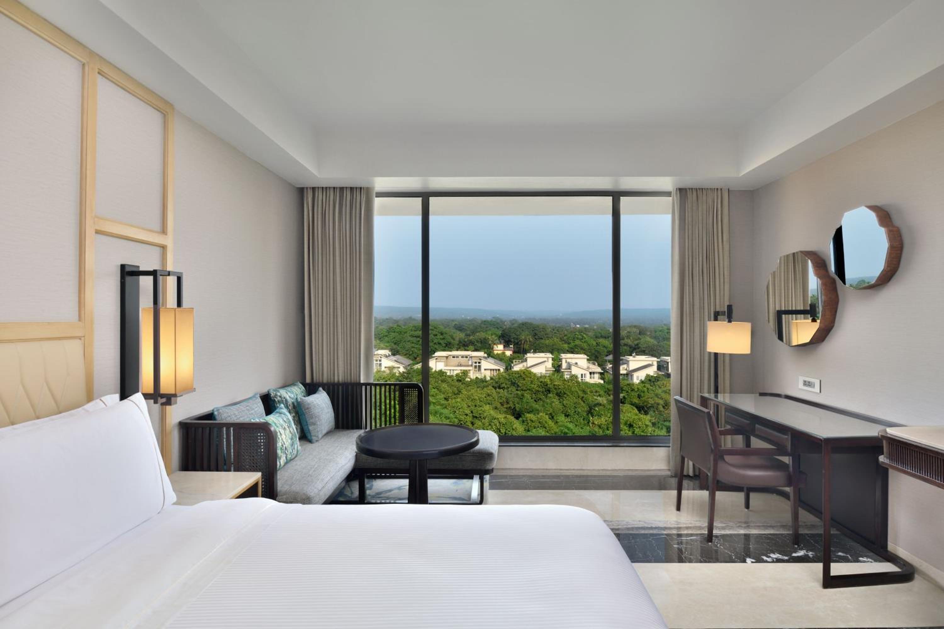 Deluxe hill view Guest Room with 2 Twin/Single Bed(s) – INR 1000 SPA Credit (Stay between Sunday to Thursday) – Complimentary beer on arrival and free shuttle to the beach – Enjoy extra INR 750 credit at Drift Pool Bar once during your stay Deluxe hill view Guest Room with 2 Twin/Single Bed(s) – INR 1000 SPA Credit (Stay between Sunday to Thursday) – Complimentary beer on arrival and free shuttle to the beach – Enjoy extra INR 750 credit at Drift Pool Bar once during your stay