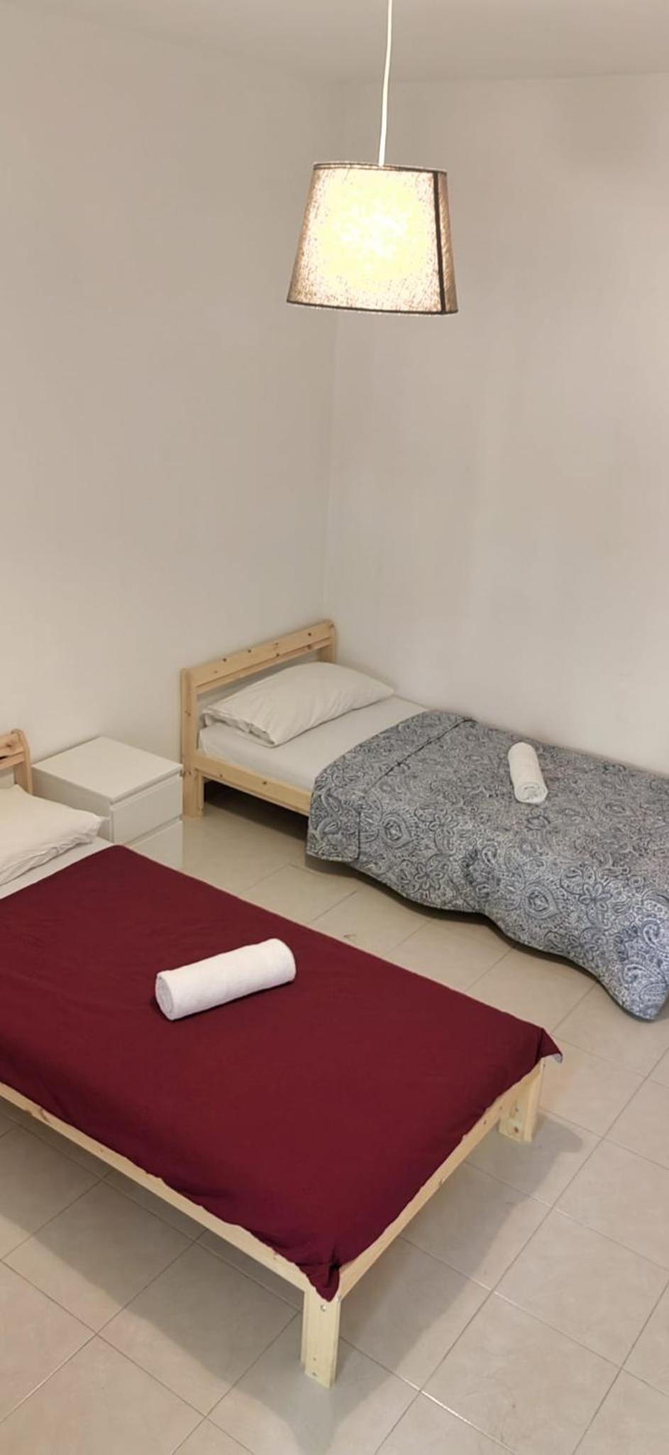 Single Bed In Female Dormitory Room