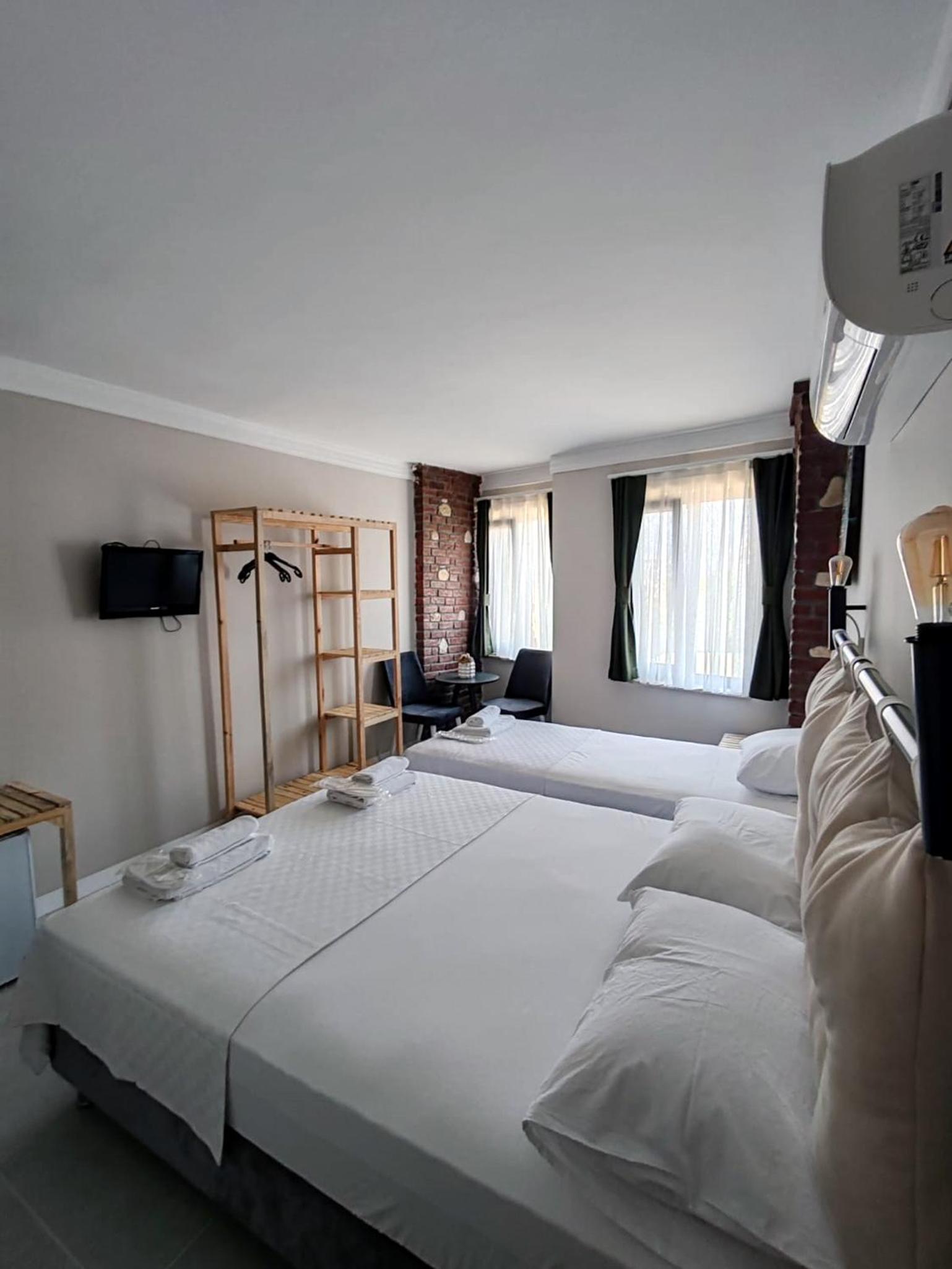 Deluxe Triple Room - Photo 7
