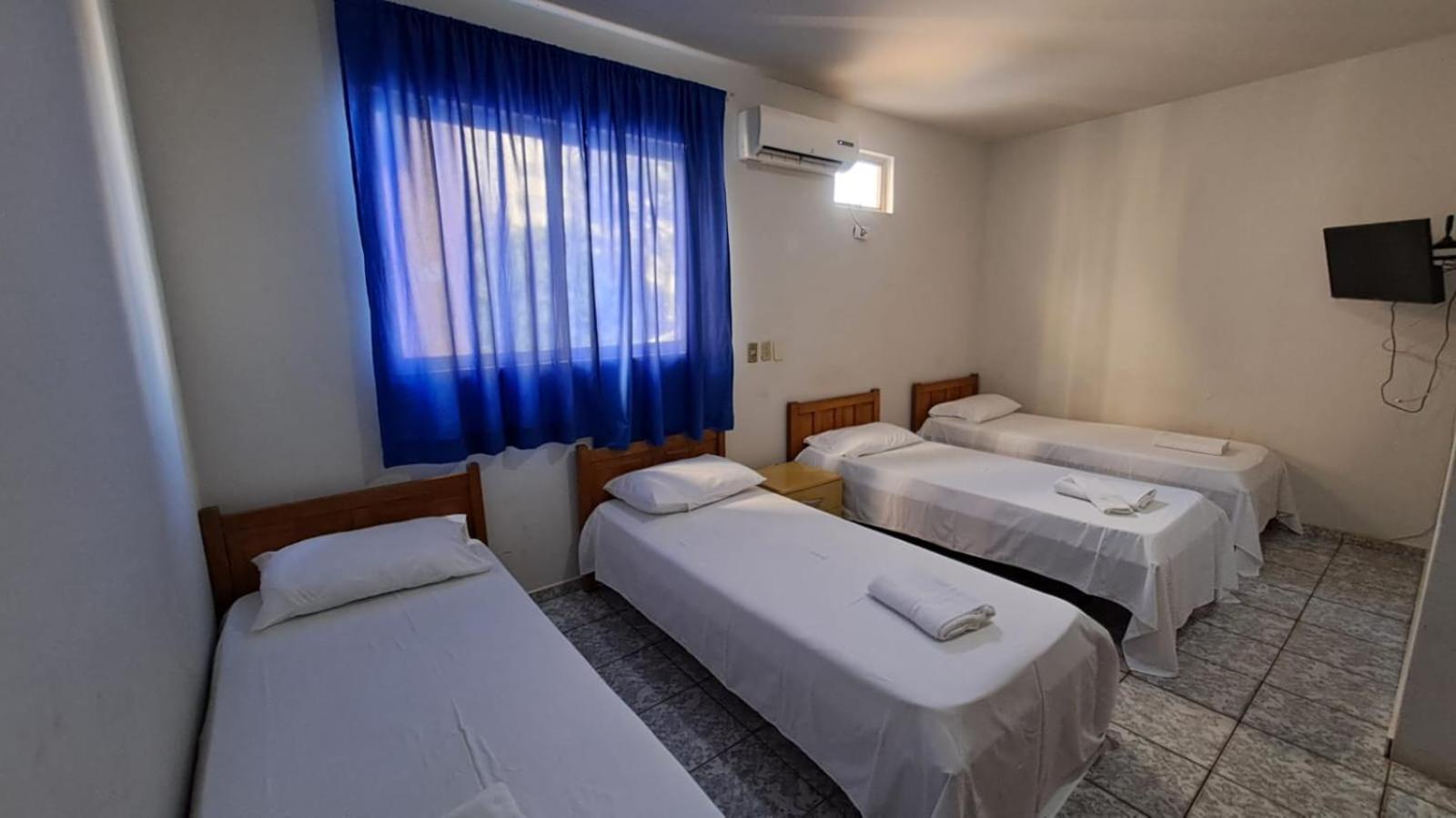Economy Quadruple Room with single beds and without fridge photo 1