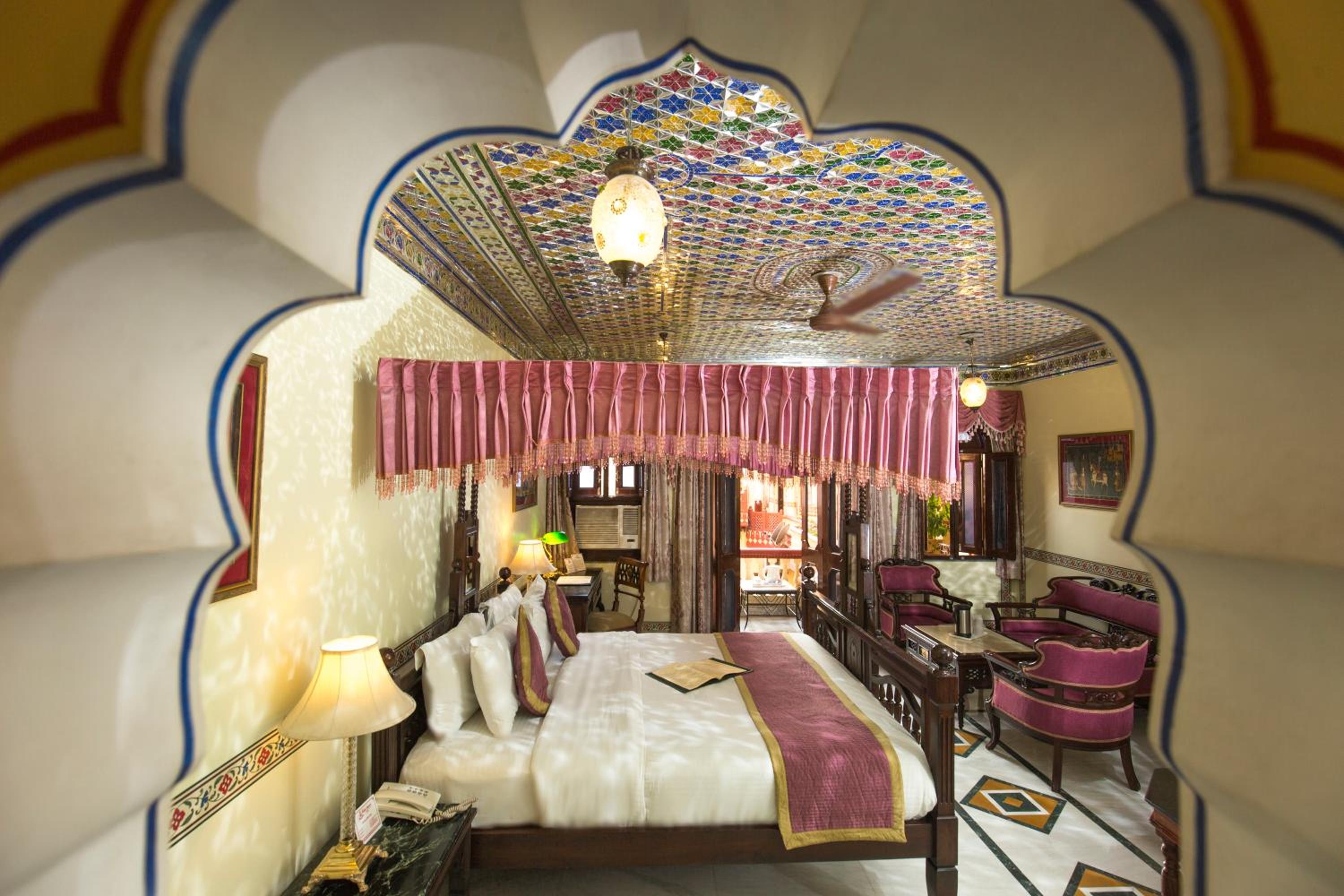 Royal Suite Family: Free pickup on arrival from train or bus station. Enjoy a daily Rajasthani dance & music show from 7–9 PM, swimming pool, and a dedicated travel desk to assist with local sightseeing tours, intercity travel arrangements & activities photo 3