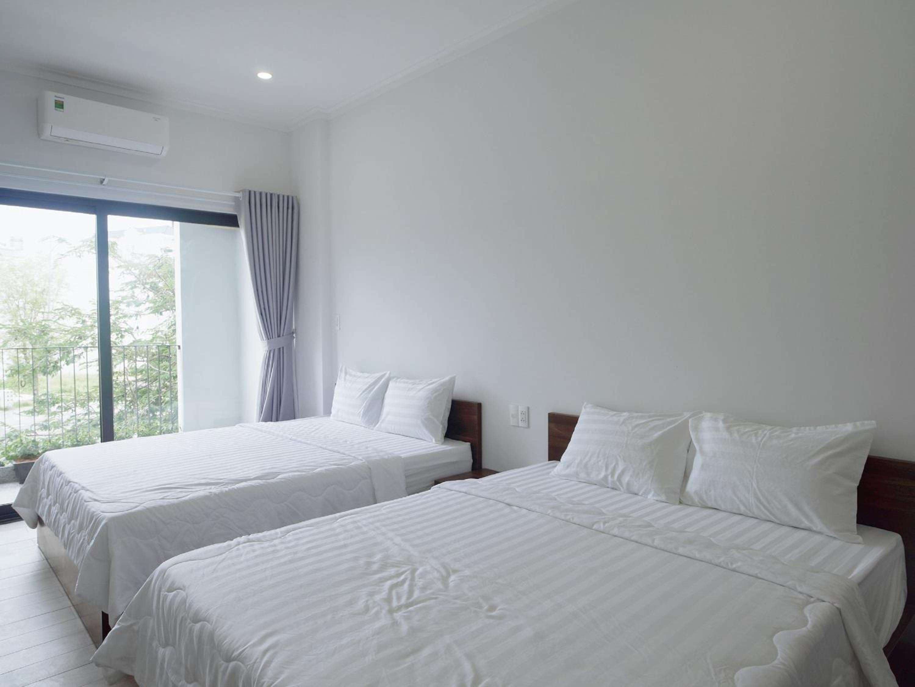 Deluxe Quadruple Room - Photo 26